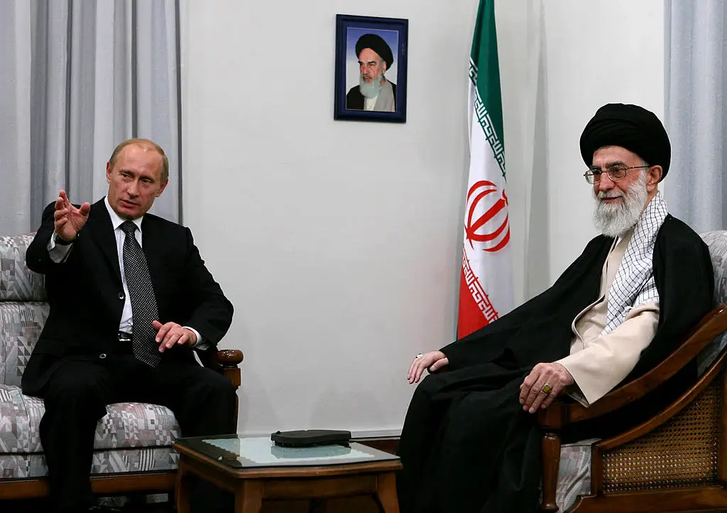 Putin and Iran's late supreme leader Ayatollah Ali Khamenei (right) pictured in 2007 (STR/AFP via Getty Images)