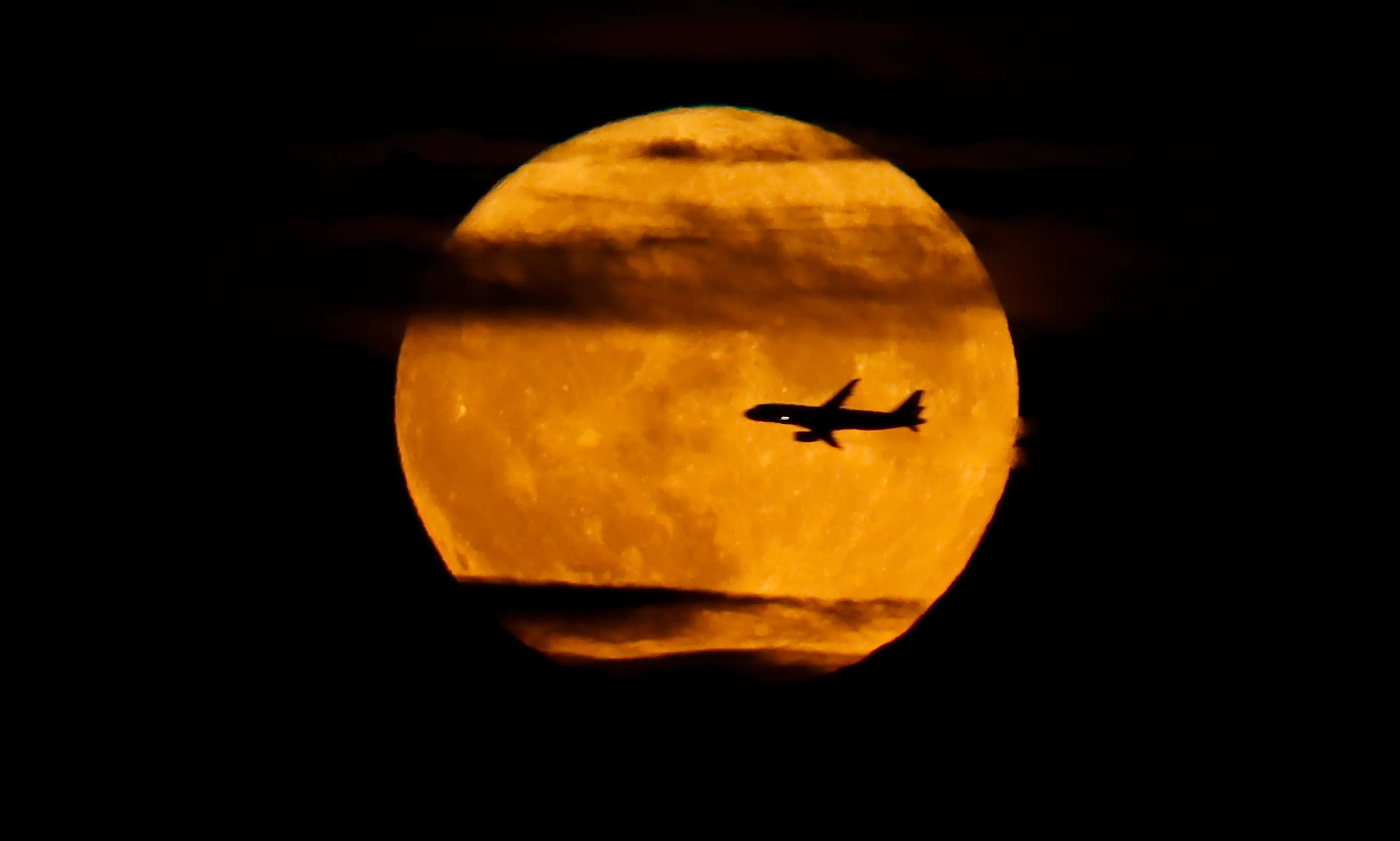 The supermoon may appear orange in colour (Gary Hershorn/Getty Images)