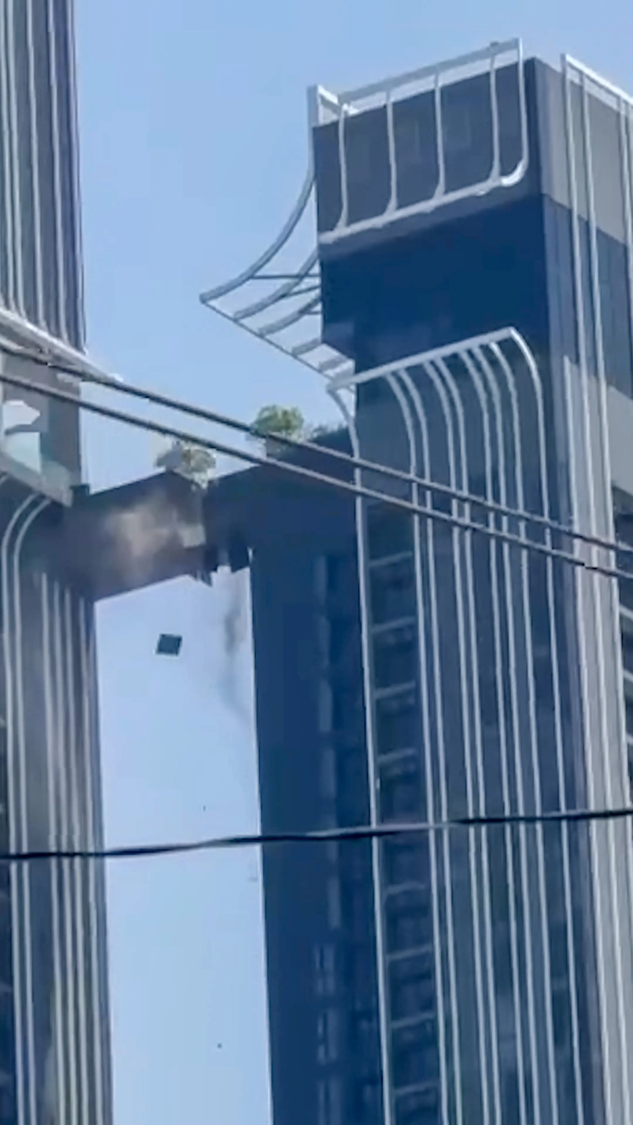 Kwon Young-jun leaped across this bridge connecting two apartments in Bangkok to save his family (Viral Press)
