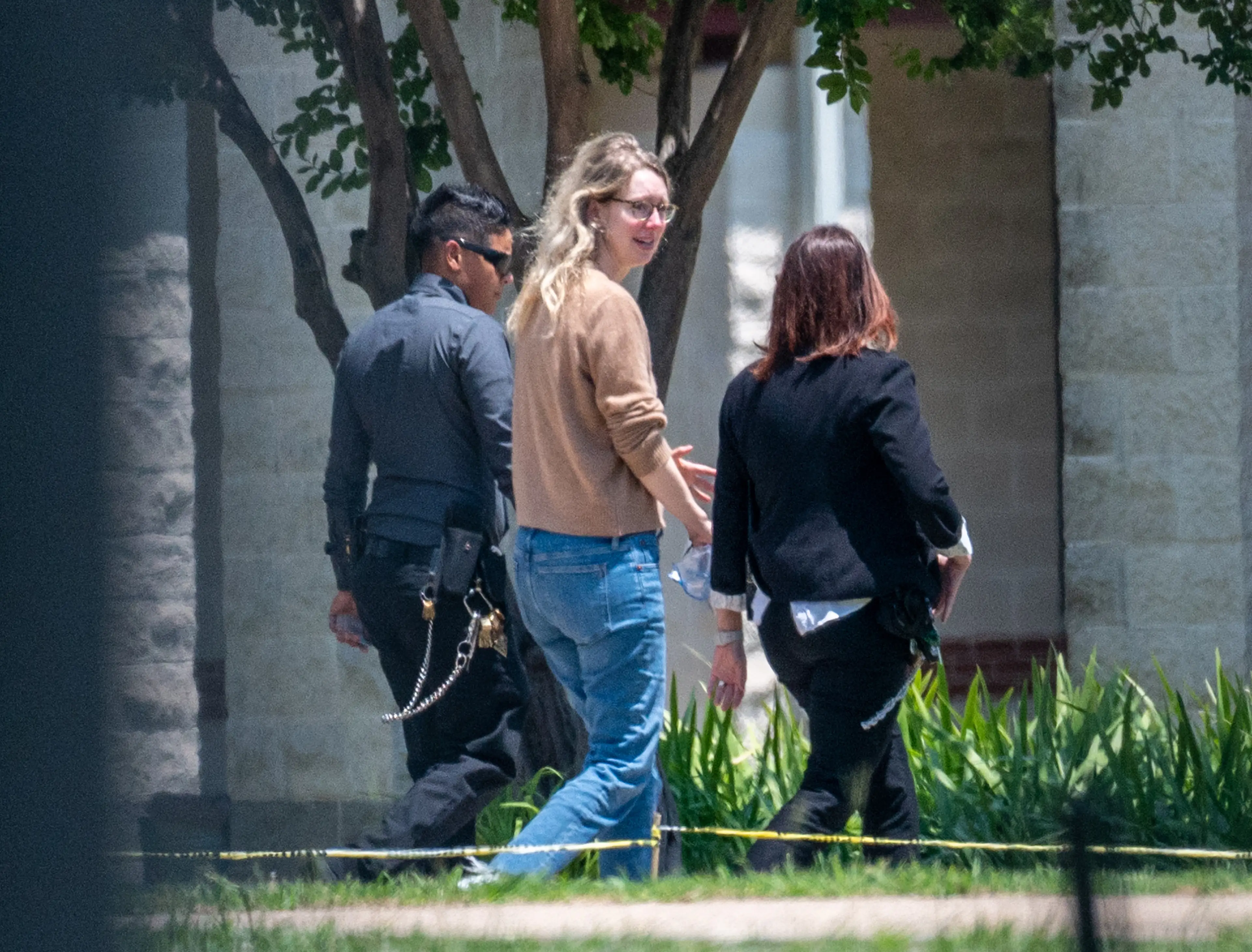 Pictures of Holmes surrendering to prison (Sergio Flores/Bloomberg via Getty Images)