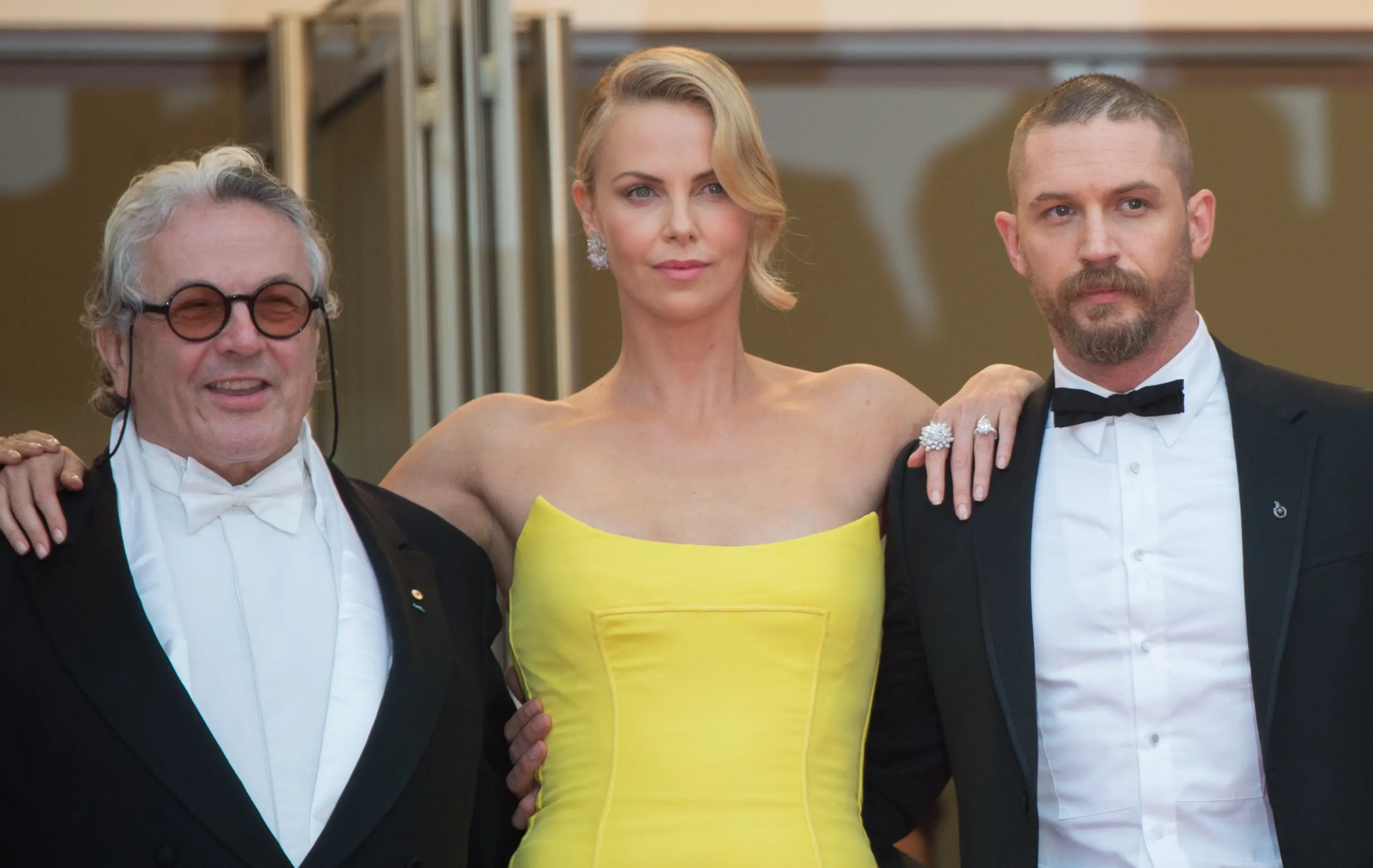 Tom Hardy, Charlie Theron, and George Miller (Samir Hussein/WireImage)