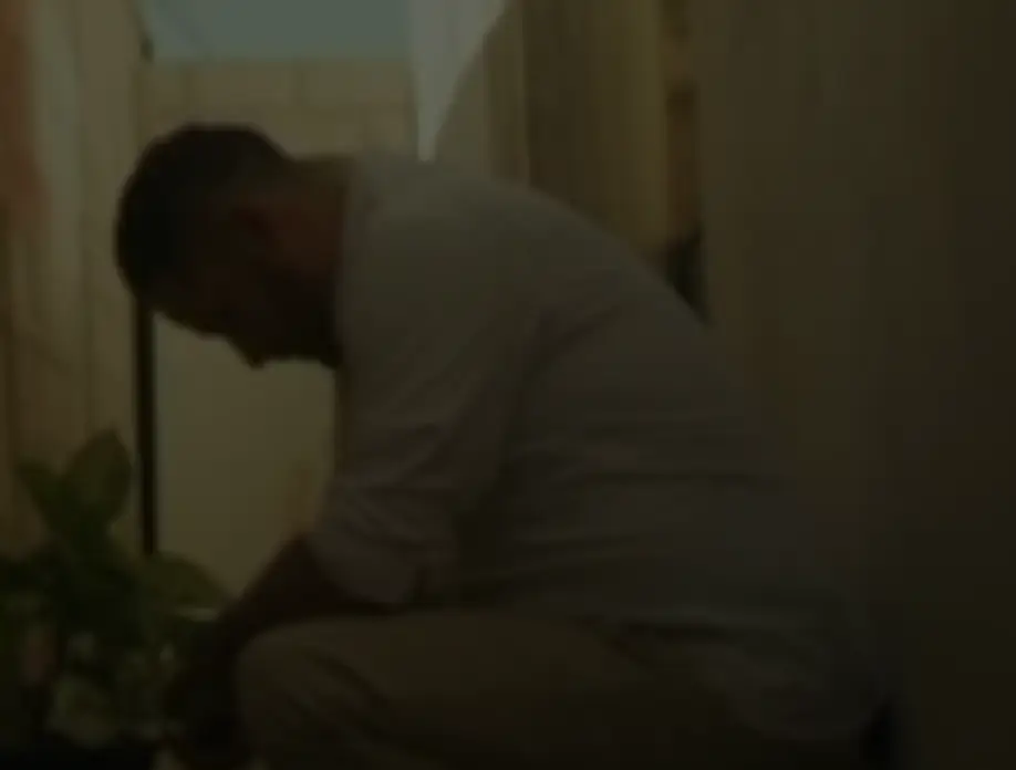 Her brother crouched in the alleyway where he found her body (Channel 4)