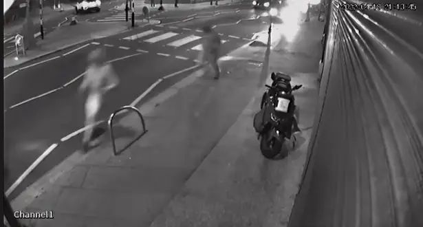 The two men sprinting from the scene.