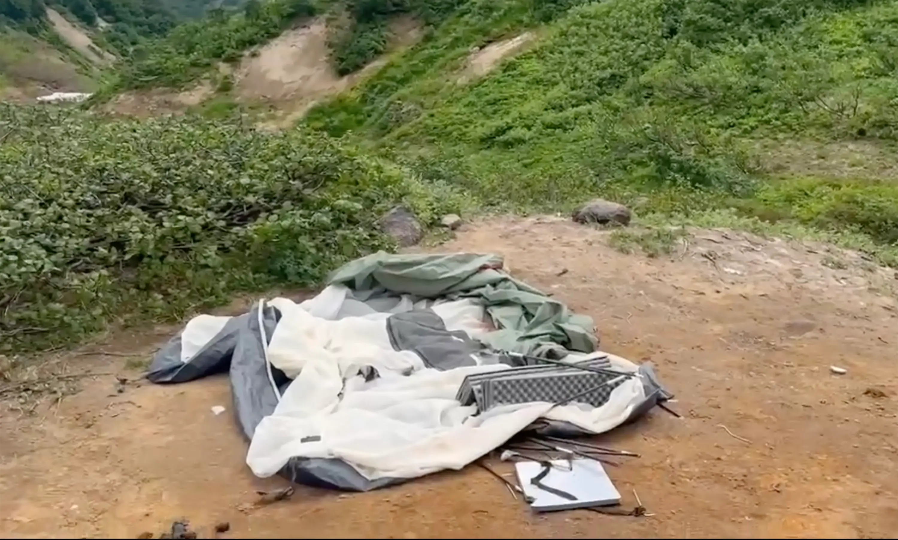 Her belongings can be seen on the ground (East2West News)