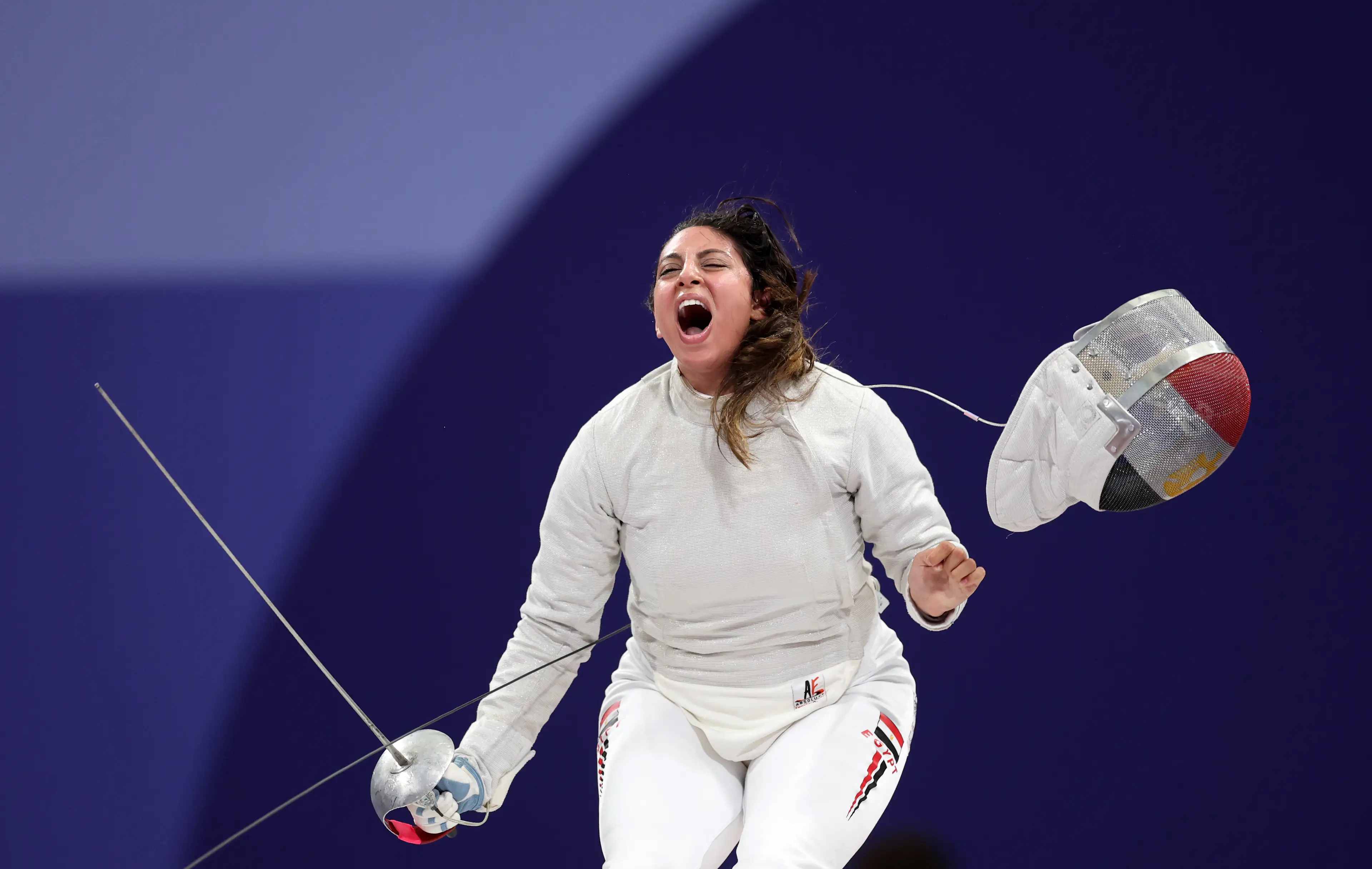 Egyptian sabreur Nada Hafez managed to get a couple of bouts in at the 2024 Olympics while being seven months pregnant. (Carl Recine/Getty Images)