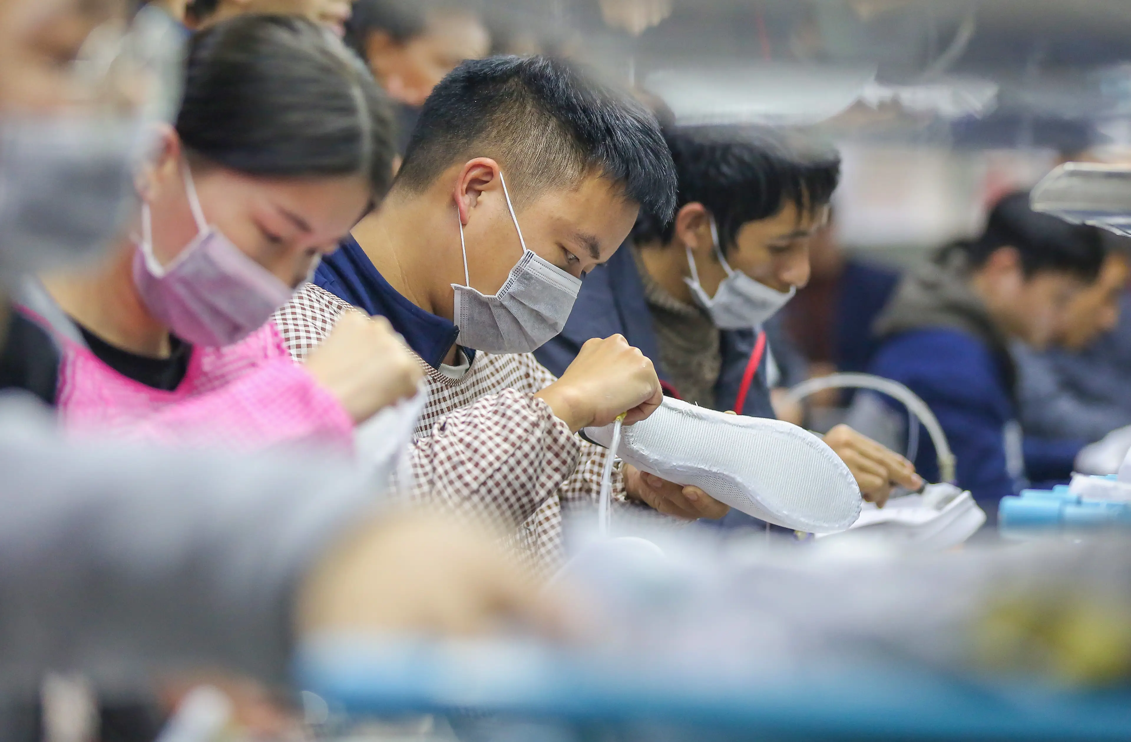 Sneakers being made in China (Feature China/Future Publishing via Getty Images)