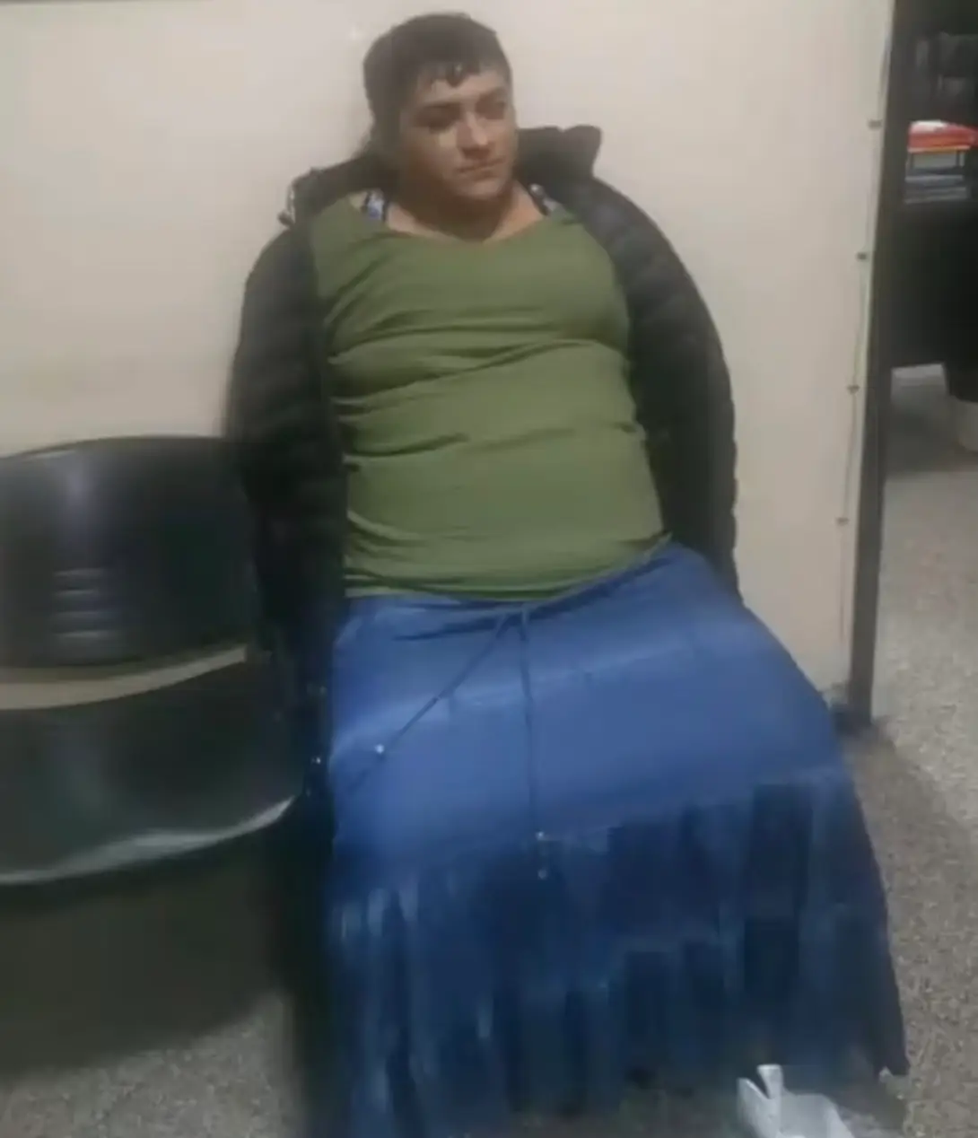 During his jail visit, he changed out of his prison threads into a khaki top and blue maxi skirt.