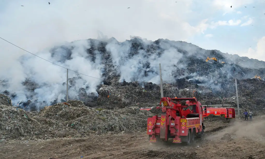 The garbage mountain often catches fire (Vipin Kumar/Hindustan Times via Getty Images)