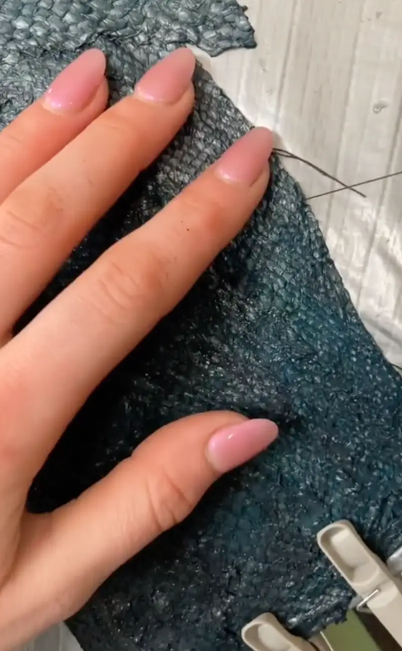 Isabelle explains that the tanning of the fish leather changes it structurally, leaving it odourless.