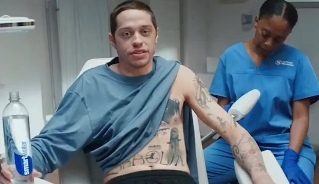 Davidson starred in a comical Smart Water advert where he joked about removing his body art in 2021 (Smart Water)