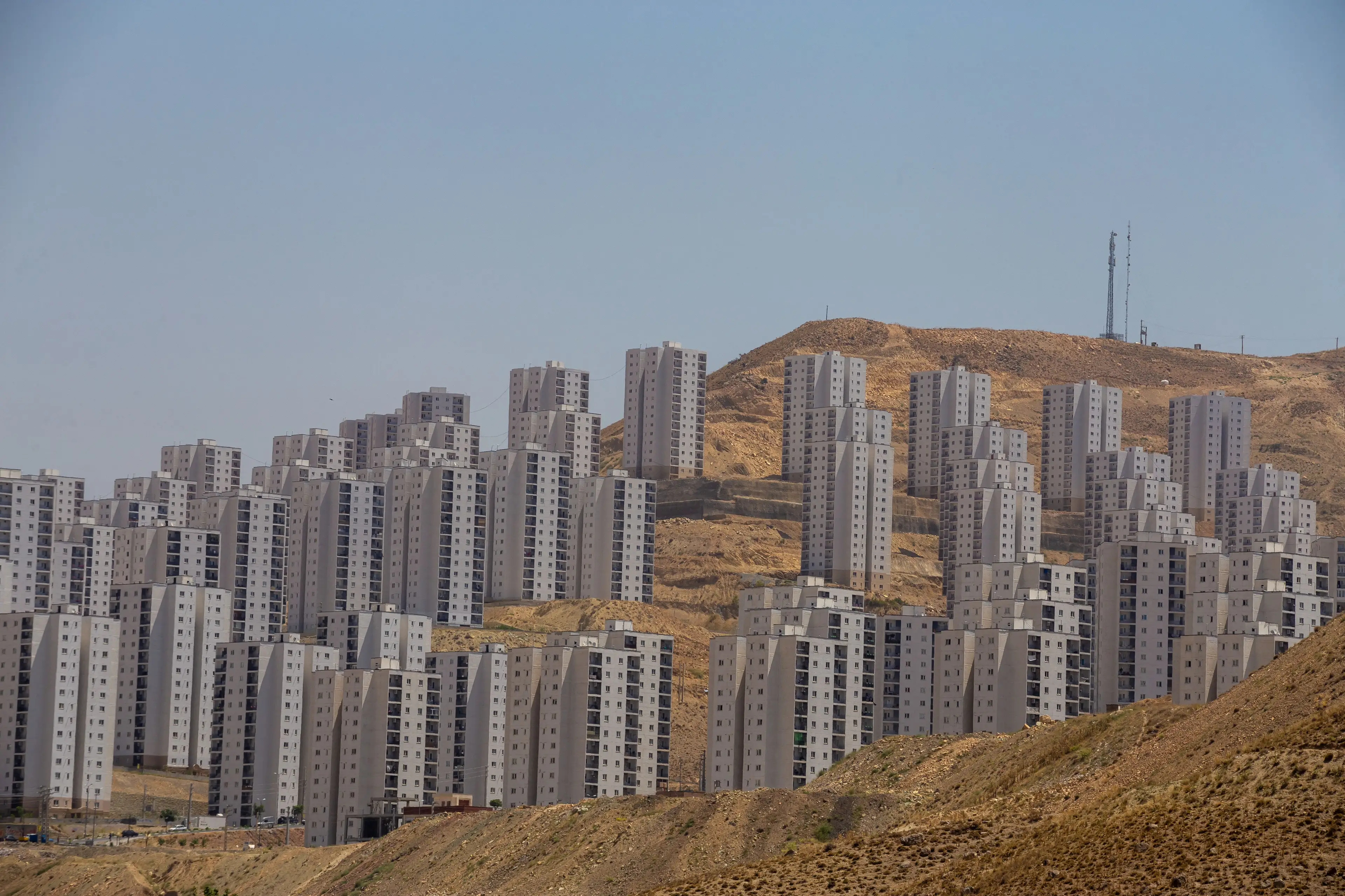 Thousands of people do live here, but thousands of homes sit empty and unfinished too. (HOSSEIN BERIS/Middle East Images/AFP via Getty Images)
