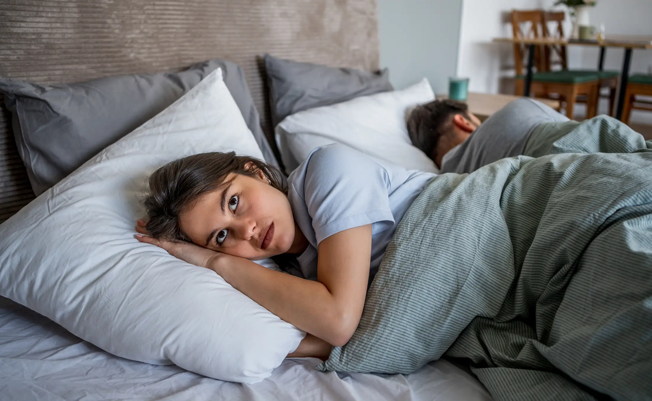 It can sometimes be harder to fall asleep in bed than on the sofa (Getty Stock Images)