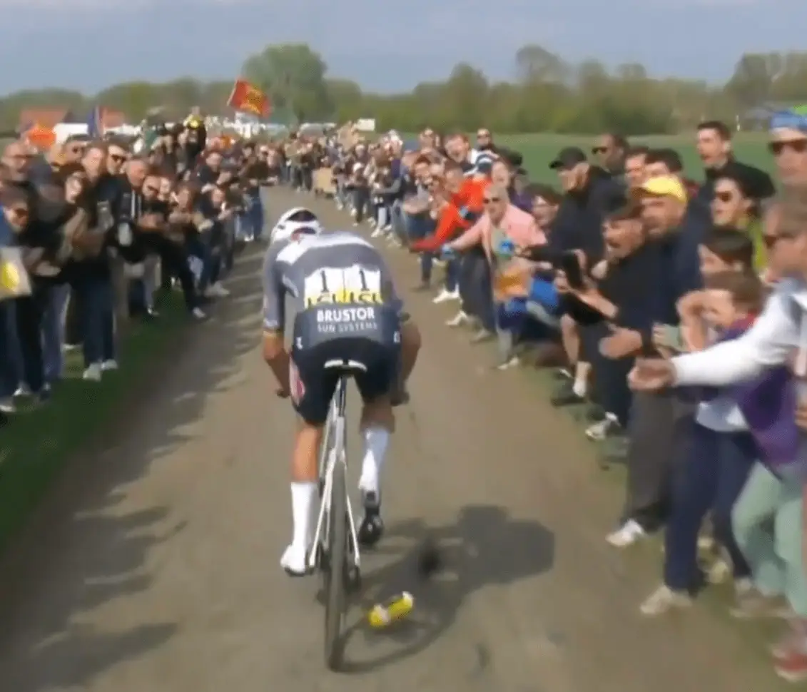 Mathieu van der Poel was seen flinching as the bottle struck him in the face (X/@NBCSCycling)