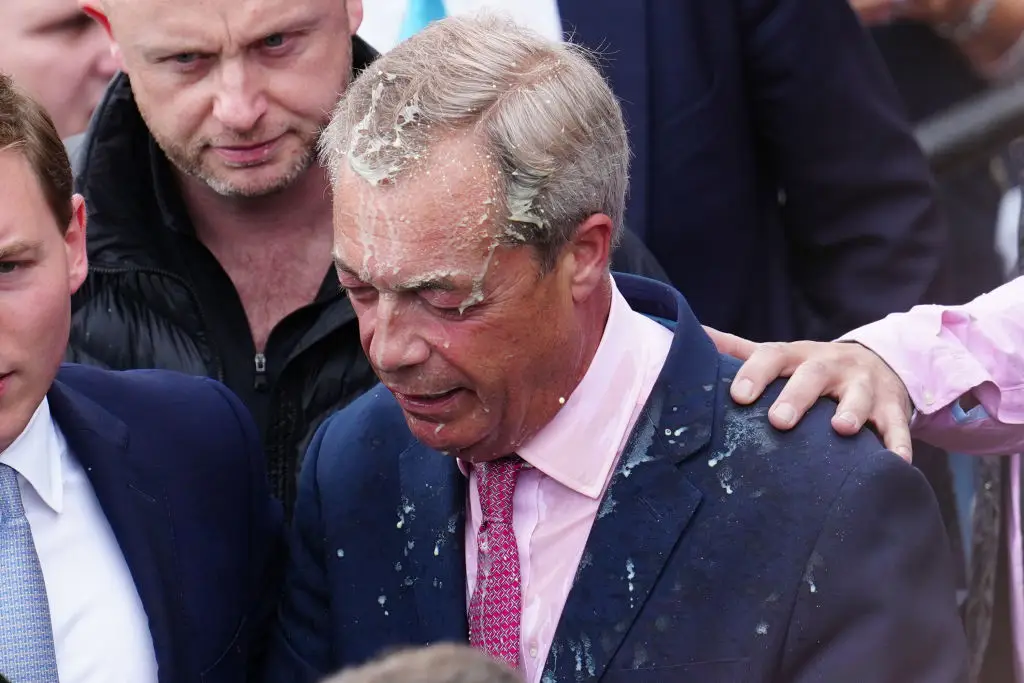Farage was left soaking wet. (Carl Court/Getty Images)