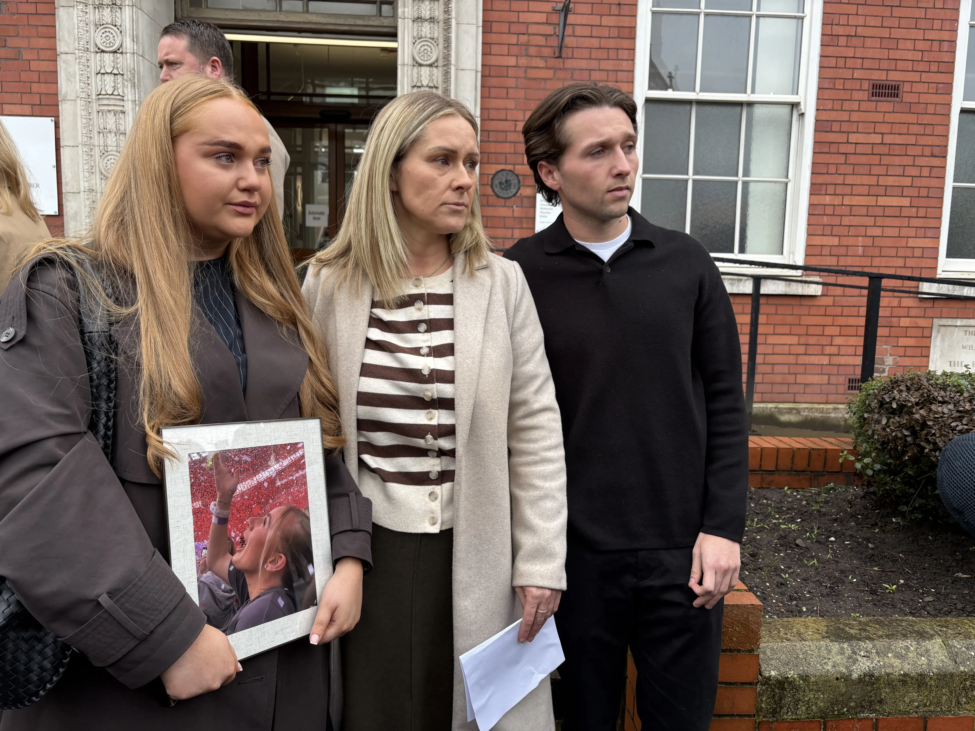 Jane Coates (centre), Lucy's friend Ella Gowing and boyfriend Sam Littler (Eleanor Barlow/PA)