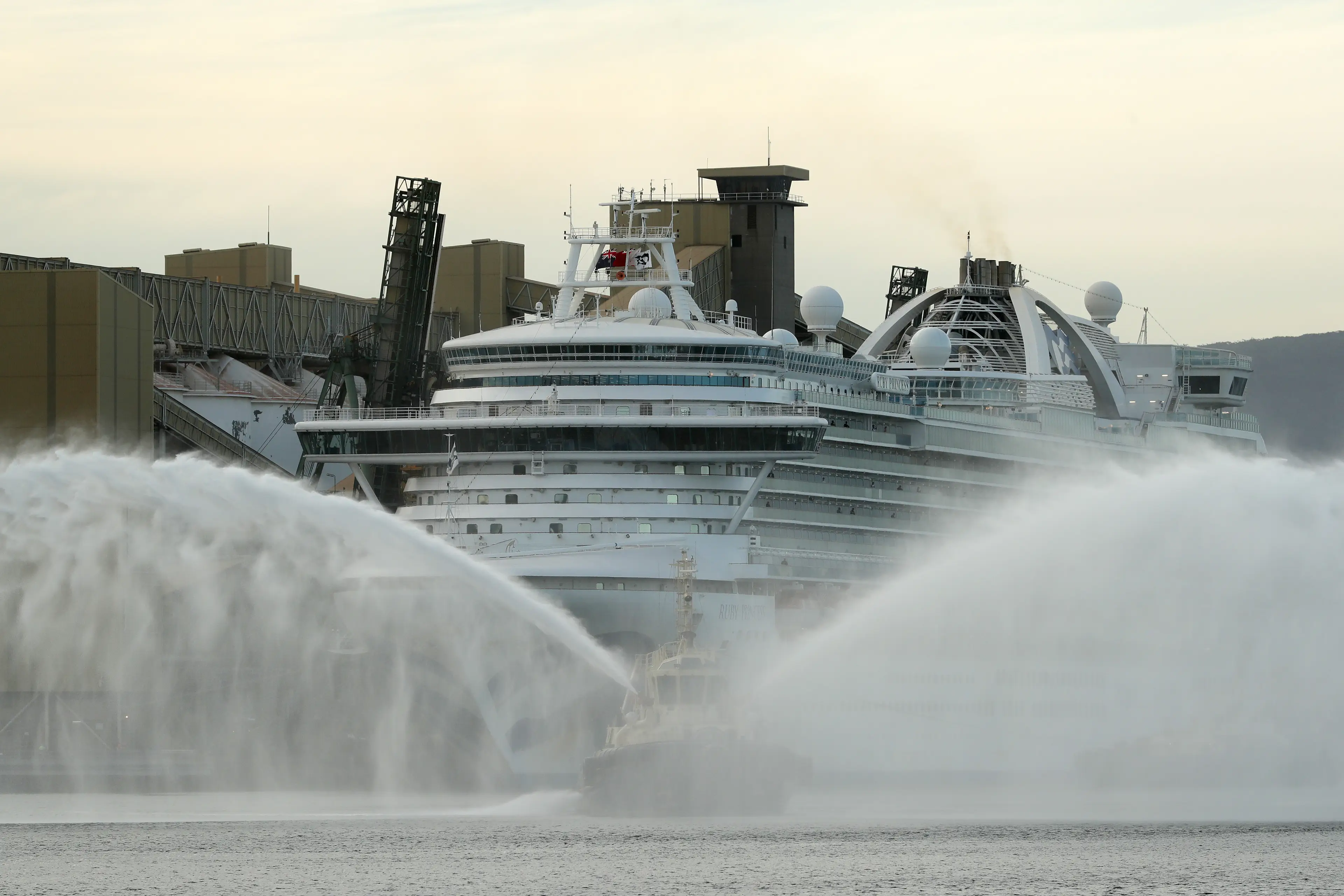 The tug boats will sometimes perform a 'water salute'. (Mark Metcalfe/Getty Images)