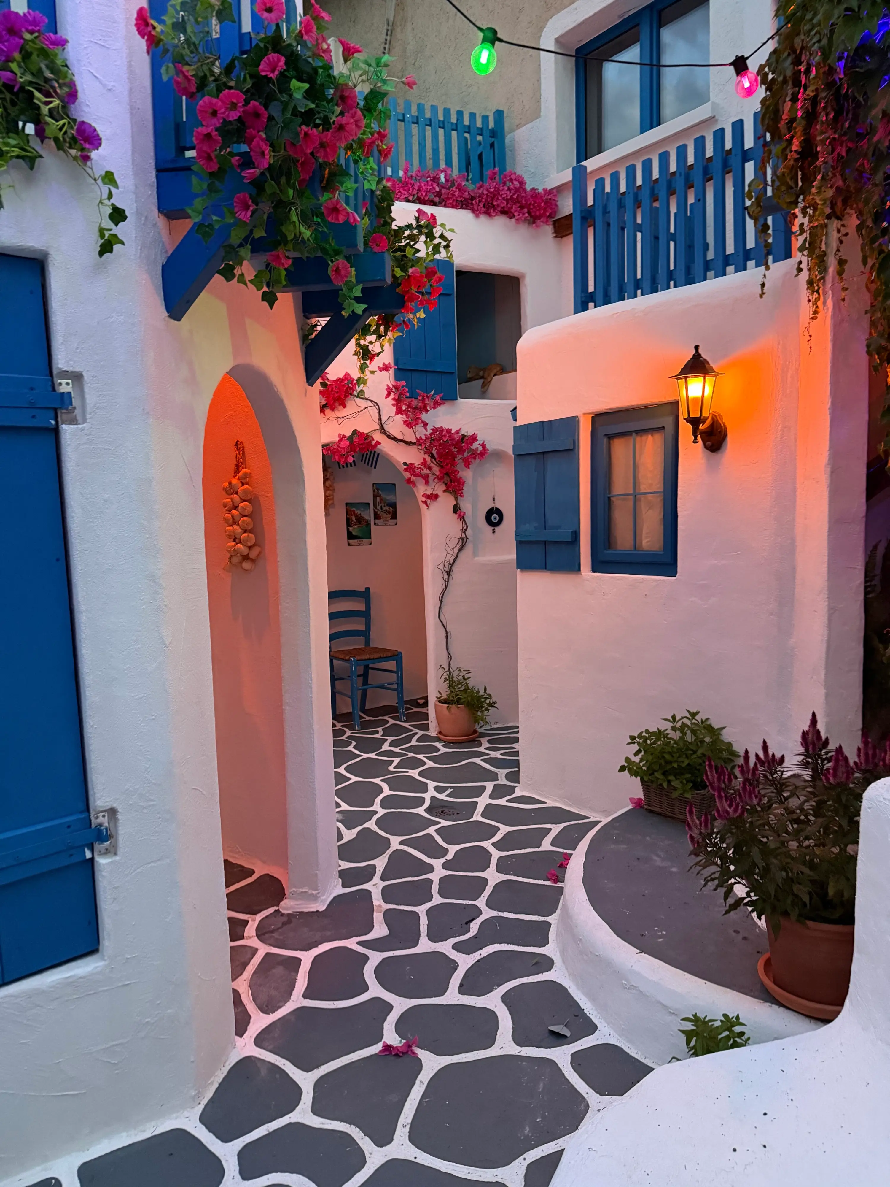 Michael's friends take pictures in his Greek village and fool people into thinking they're abroad (Michael Scherrer / SWNS)