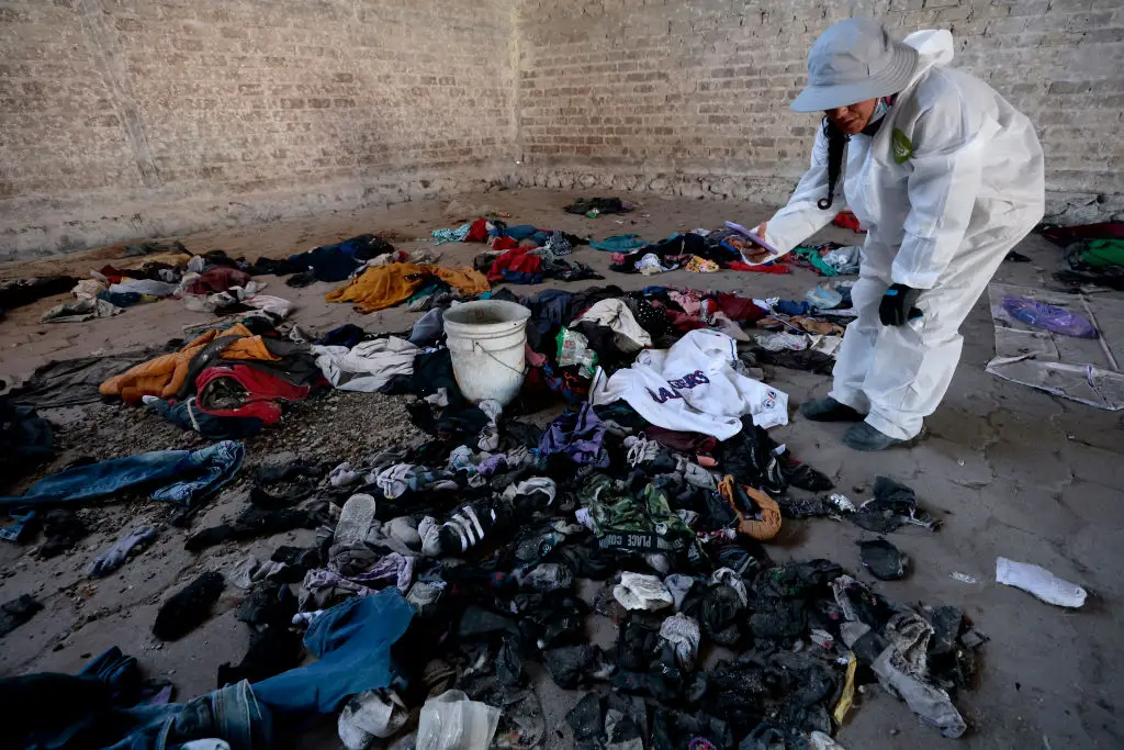 Numerous items of clothing and shoes were recovered (Photo by ULISES RUIZ/AFP via Getty Images)