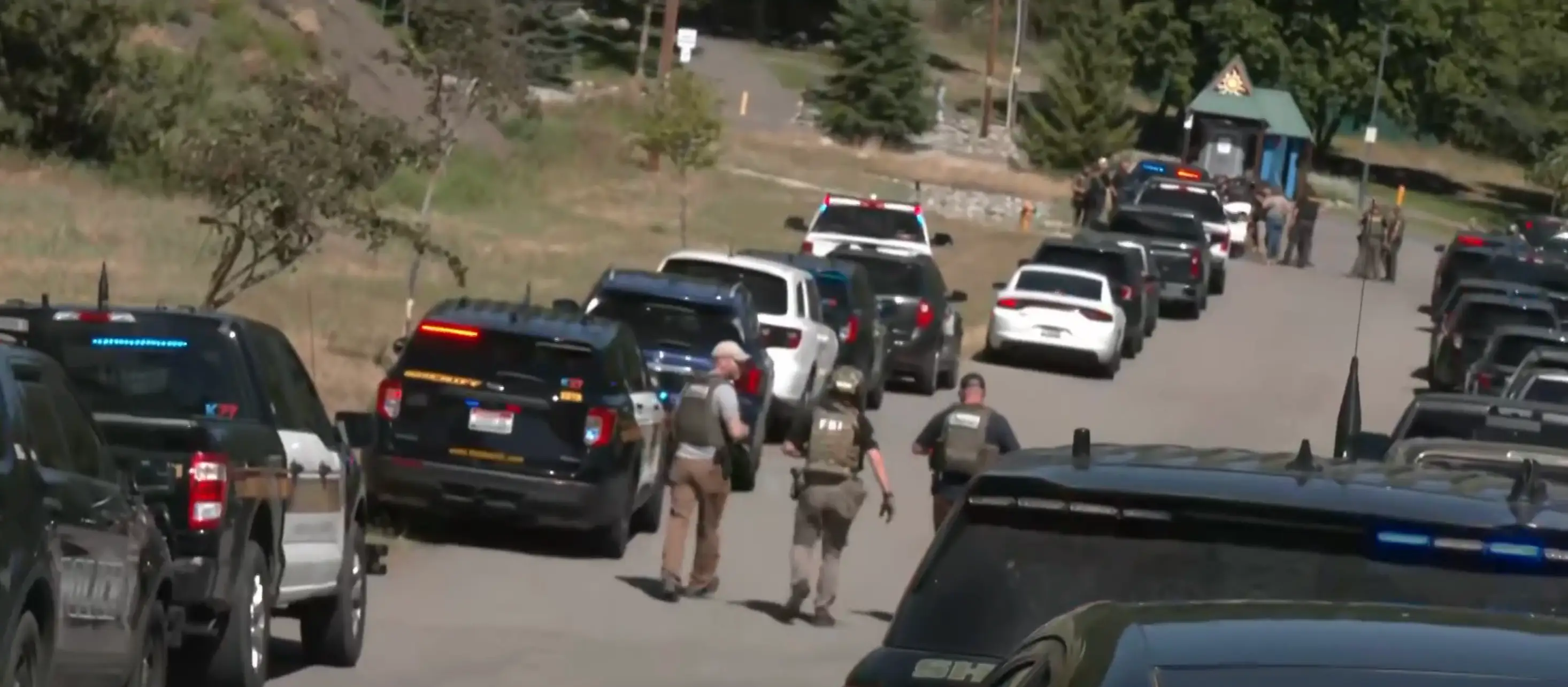 Two firefighters were shot dead and a third is 'fighting for his life' in hospital after a sniper lit a fire and ambushed them (NBC)