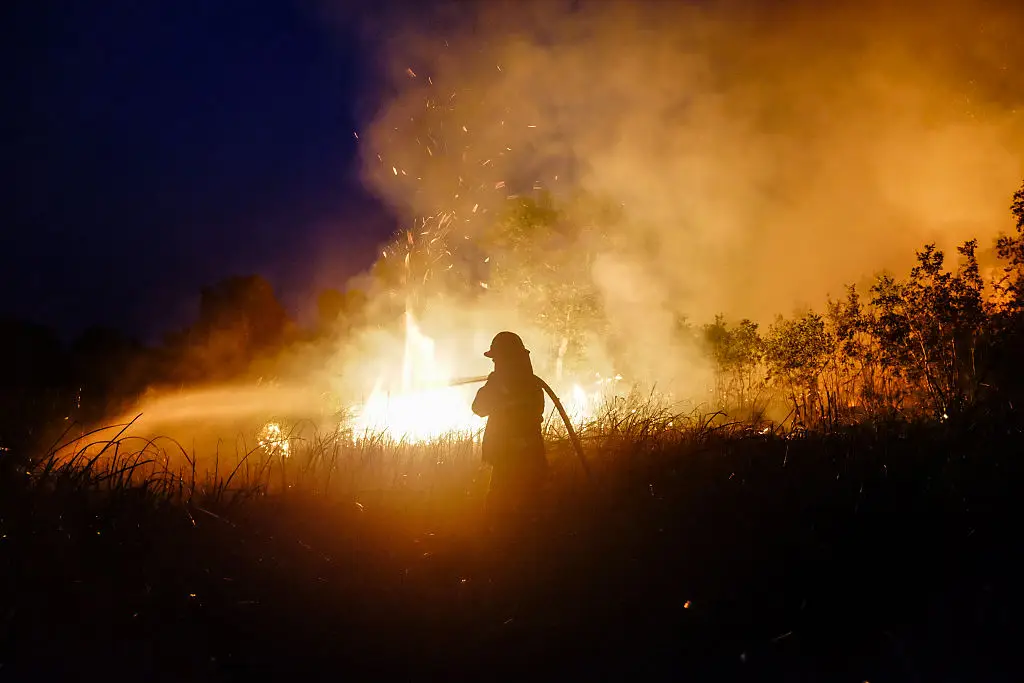 Different areas can also see dryer conditions with an increased wildfire risk (Bagus Kurniawan/NurPhoto via Getty Images)