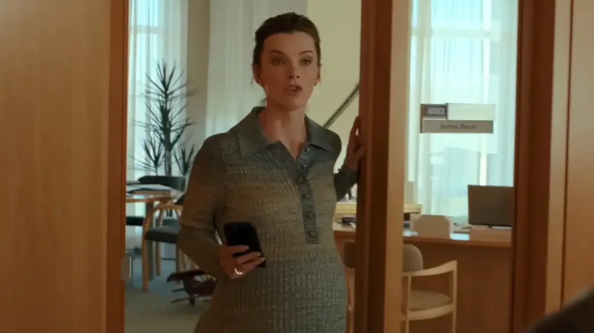 Betty Gilpin stars as Sydney Bloom in Office Romance (Netflix)