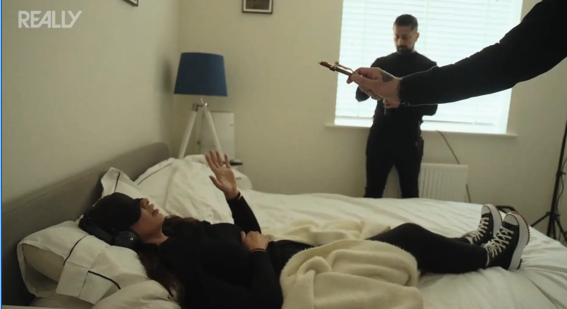 She reached out to the crucifix, despite not being able to see it (Really/Discovery+)