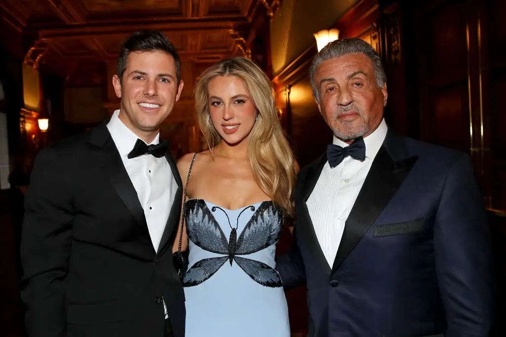 Stallone grabbed his hand (Tasos Katopodis/Getty Images for The Dwight D. Opperman Foundation)