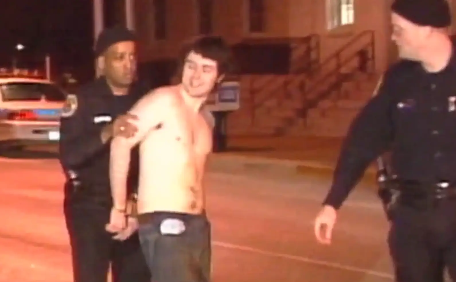 Jeffrey Franklin smiled and spat at people as he was arrested after murdering his parents. (YouTube/WHNT News 19)