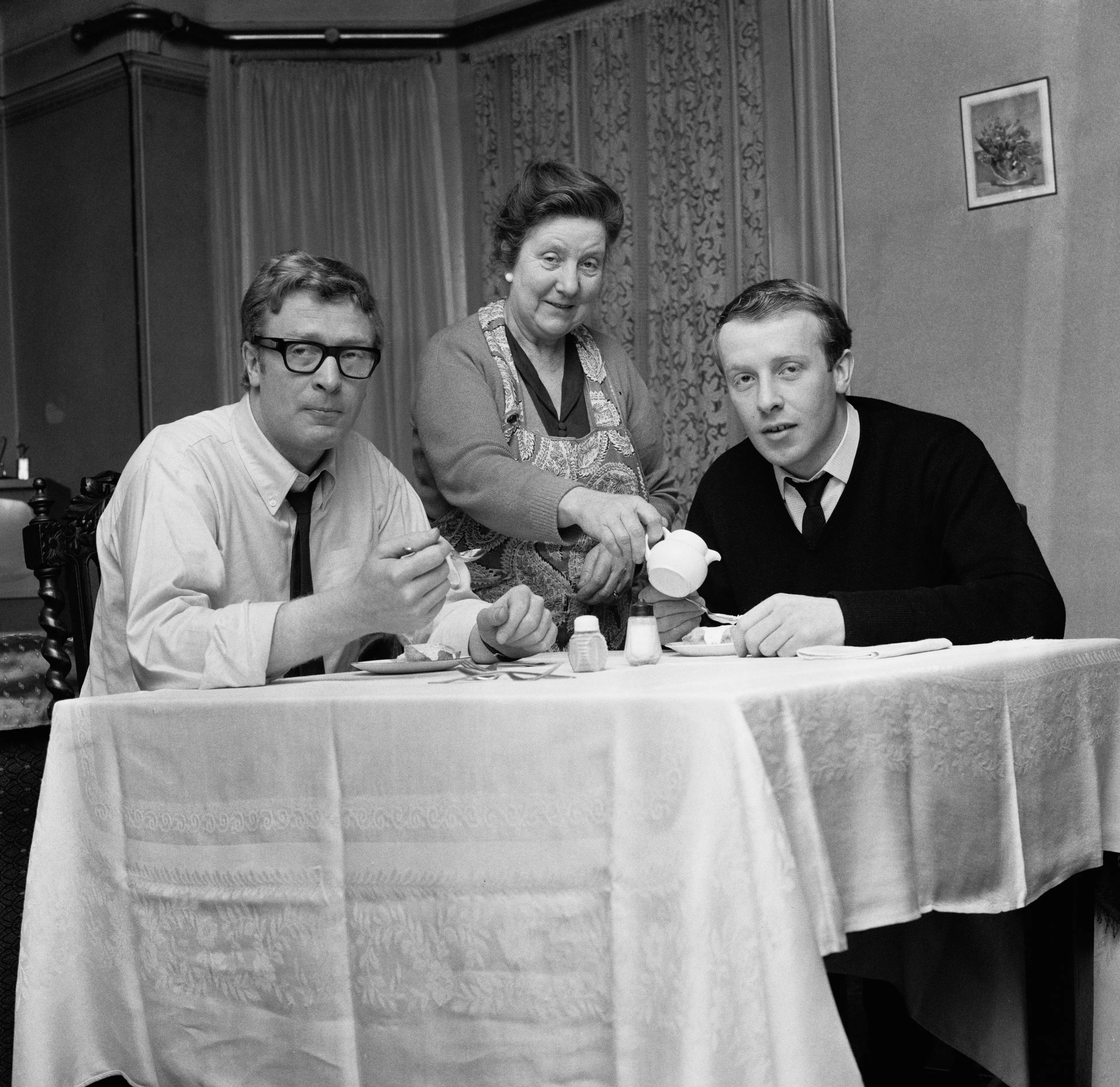 Michael Caine pictured with his brother Stanley and mother Ellen in 1964 (Harry Dempster/Daily Express/Hulton Archive/Getty Images)