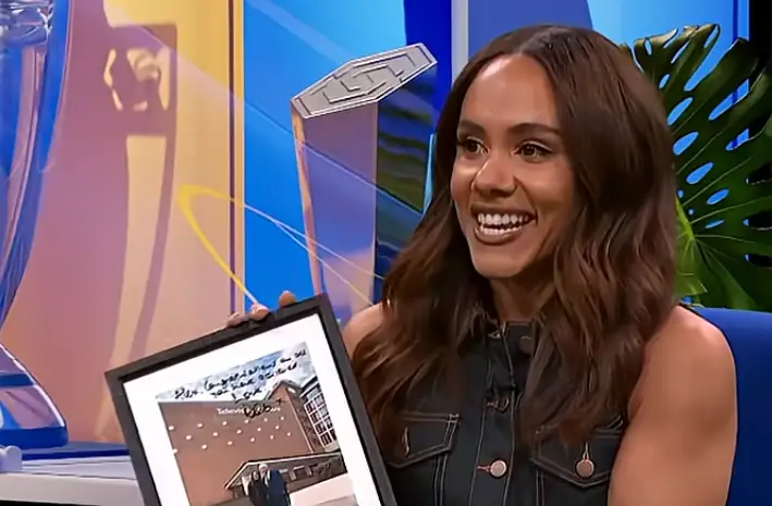 Scott was presented with a picture of her with the first host of Football Focus (BBC)