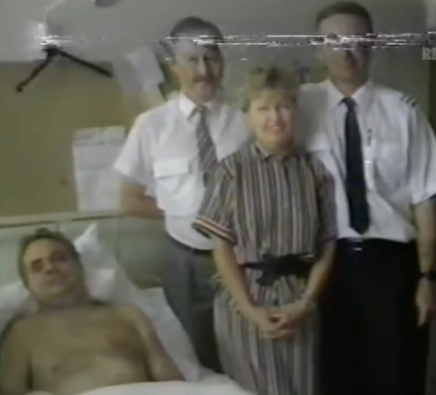 The captain seen with the crew members who helped to save his life (YouTube/Retrontario/NBC News)