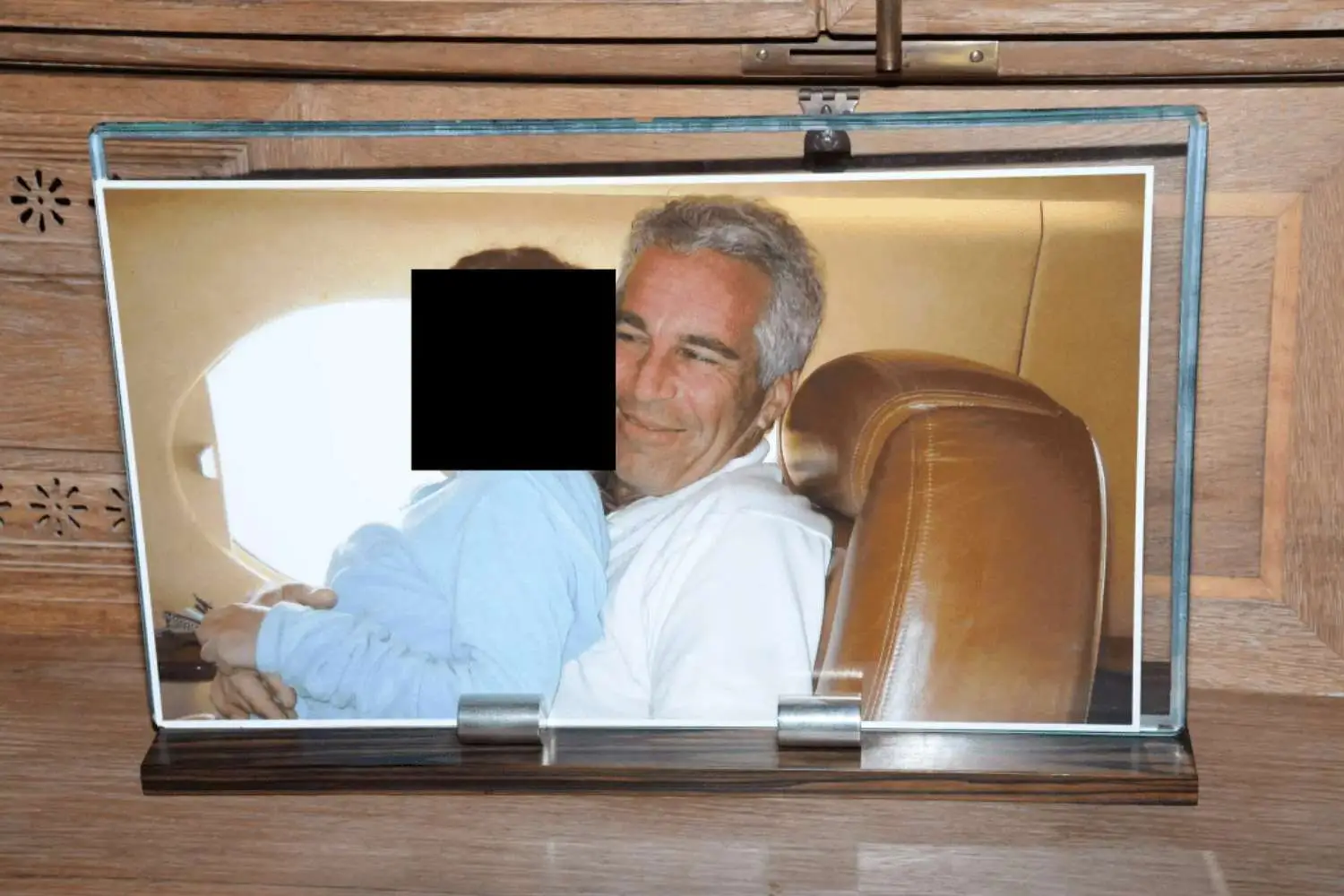 Jeffrey Epstein was shown cuddling children in photos released by the DOJ (DOJ)
