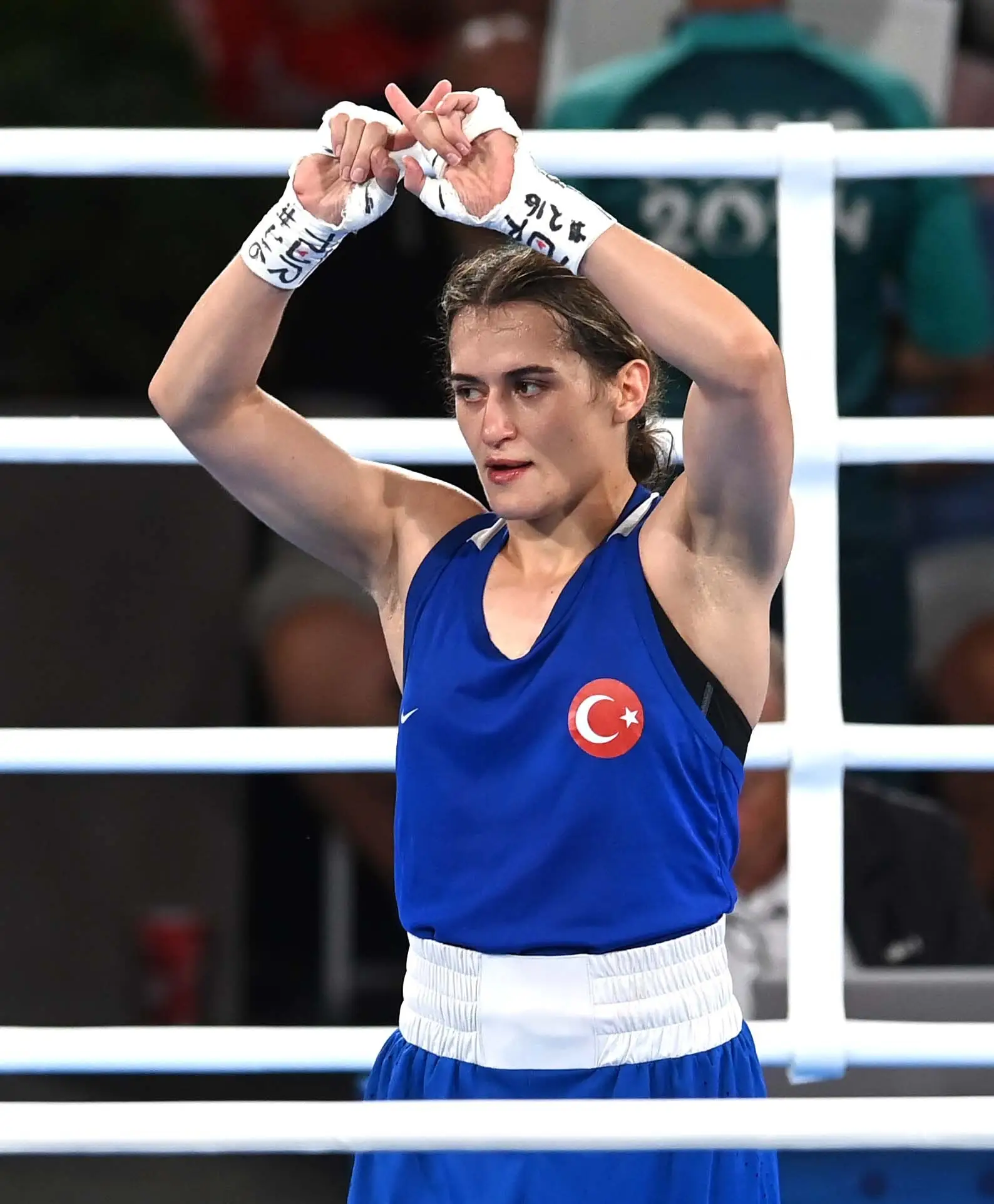 The X gesture made after Esra Yildiz Kahraman's loss. (Fabio Bozzani/Anadolu via Getty Images)