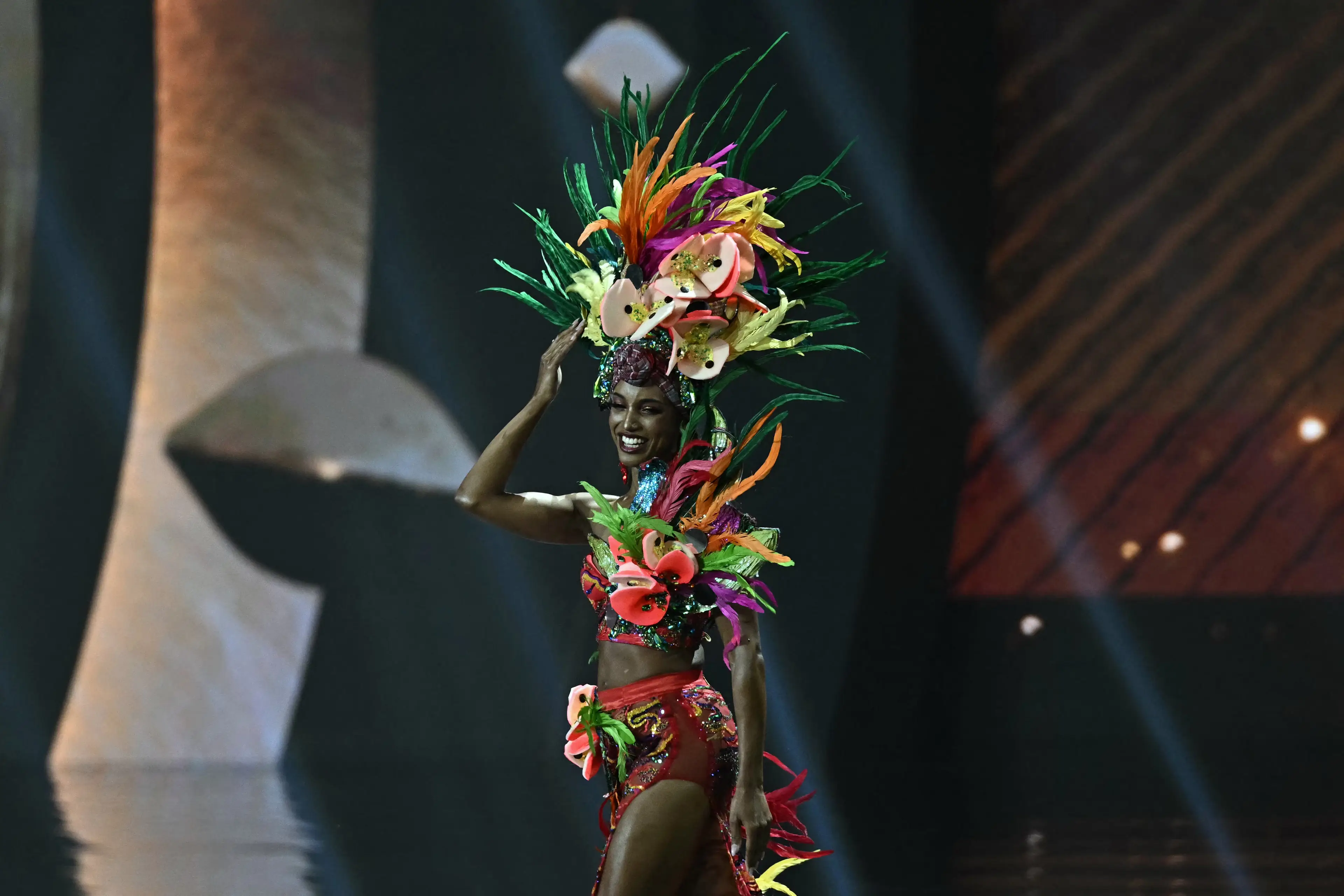 Miss Jamaica during the 2025 Miss Universe national costume presentation (LILLIAN SUWANRUMPHA/AFP via Getty Images)
