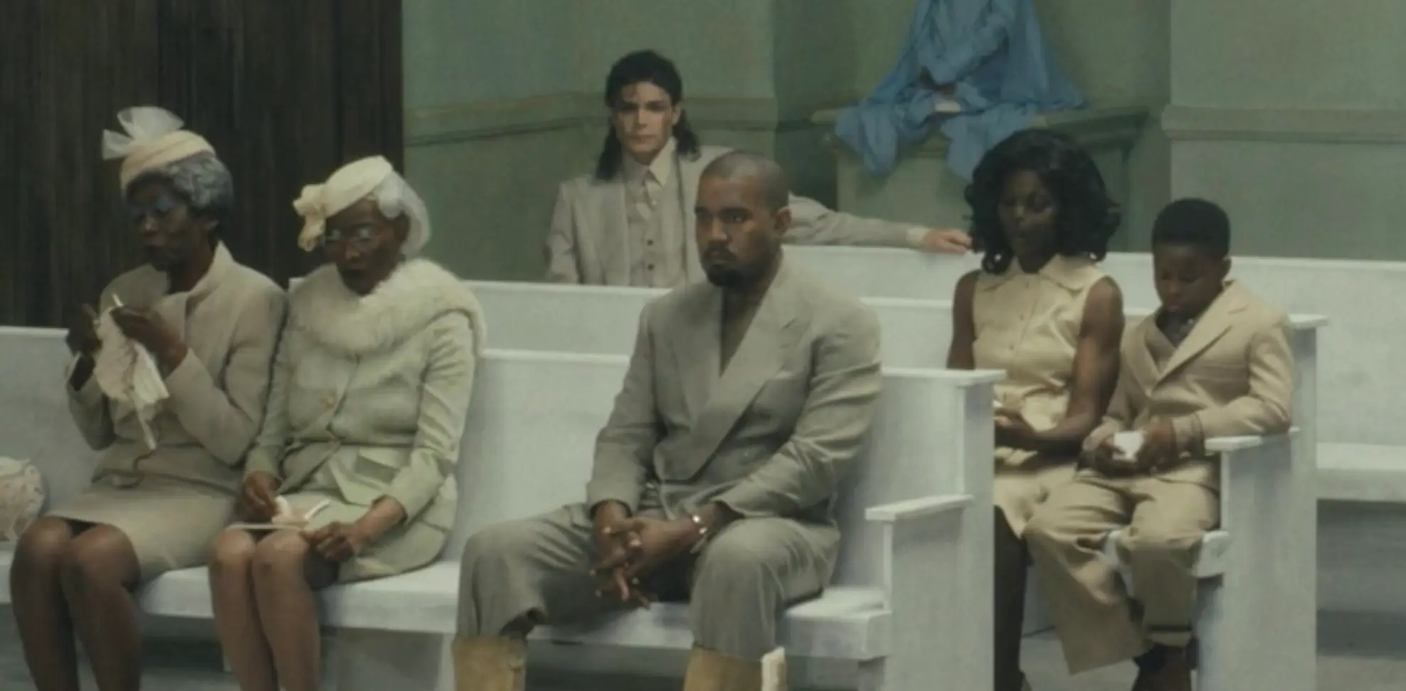 Fans were left baffled after they noticed that a man resembling Michael Jackson appeared to be sat on the back row (YouTube/@kanyewest)