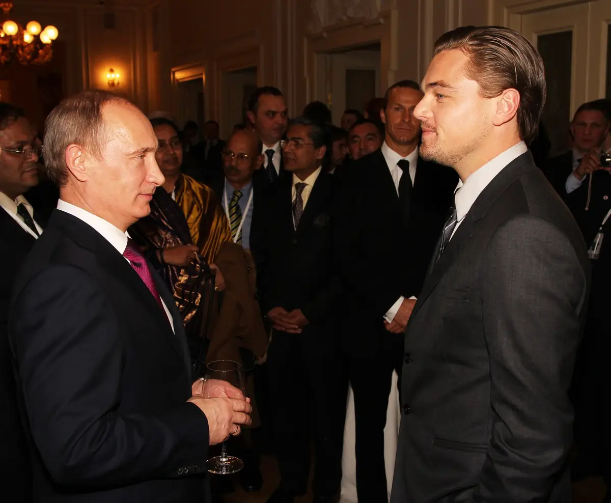 Russian President Vladimir Putin and actor Leonardo DiCaprio. (Getty Images)
