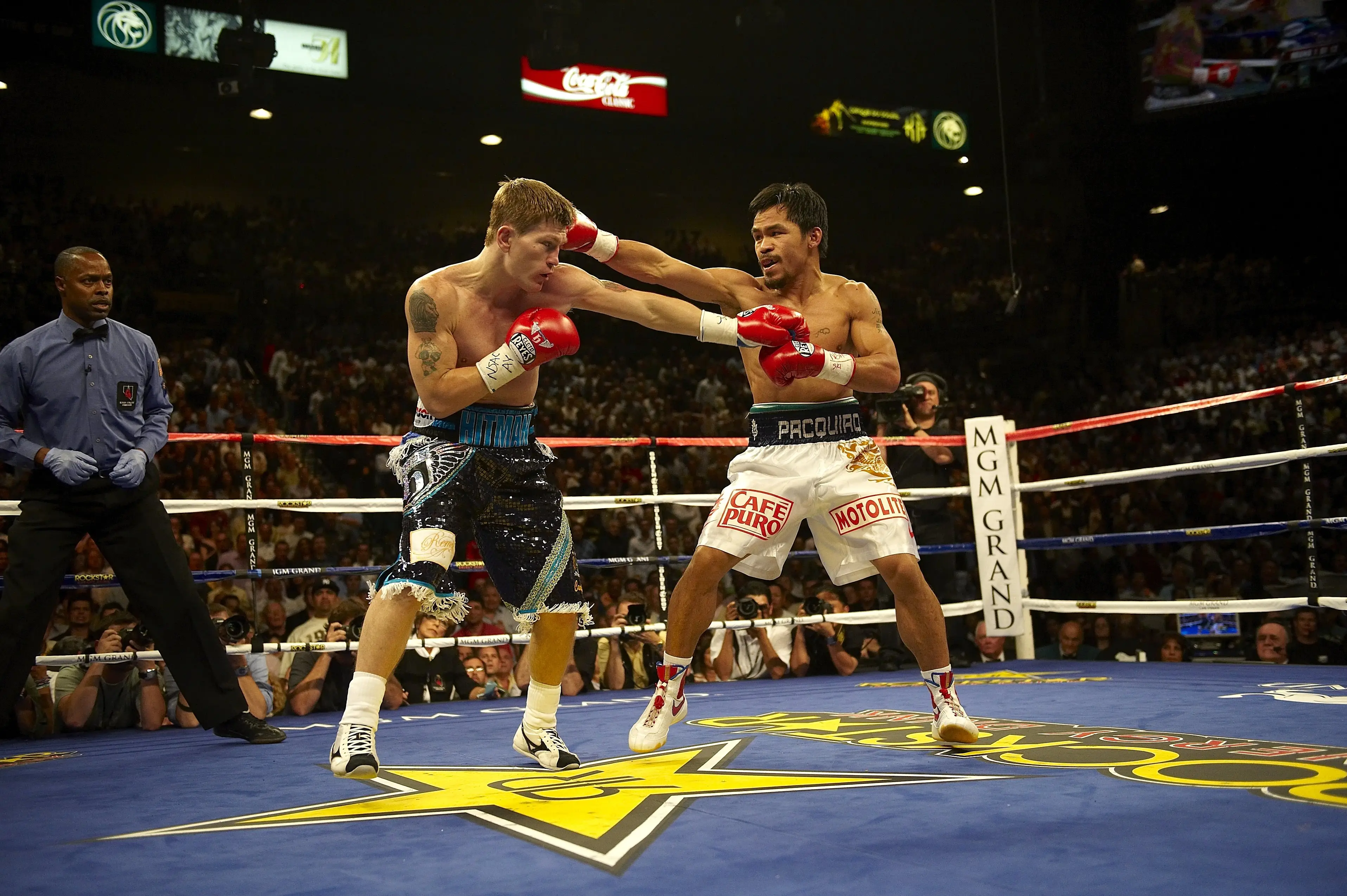 The boxing legend, pictured in the ring with Manny Pacquiao in 2009, was found dead at his home in Hyde (John Iacono /Sports Illustrated via Getty Images)
