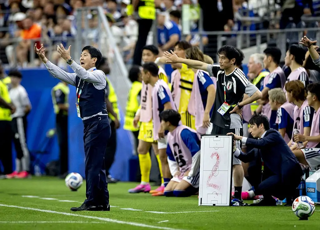 The coaching staff counted down how many minutes of added time their team had to play (ANP via Getty Images)
