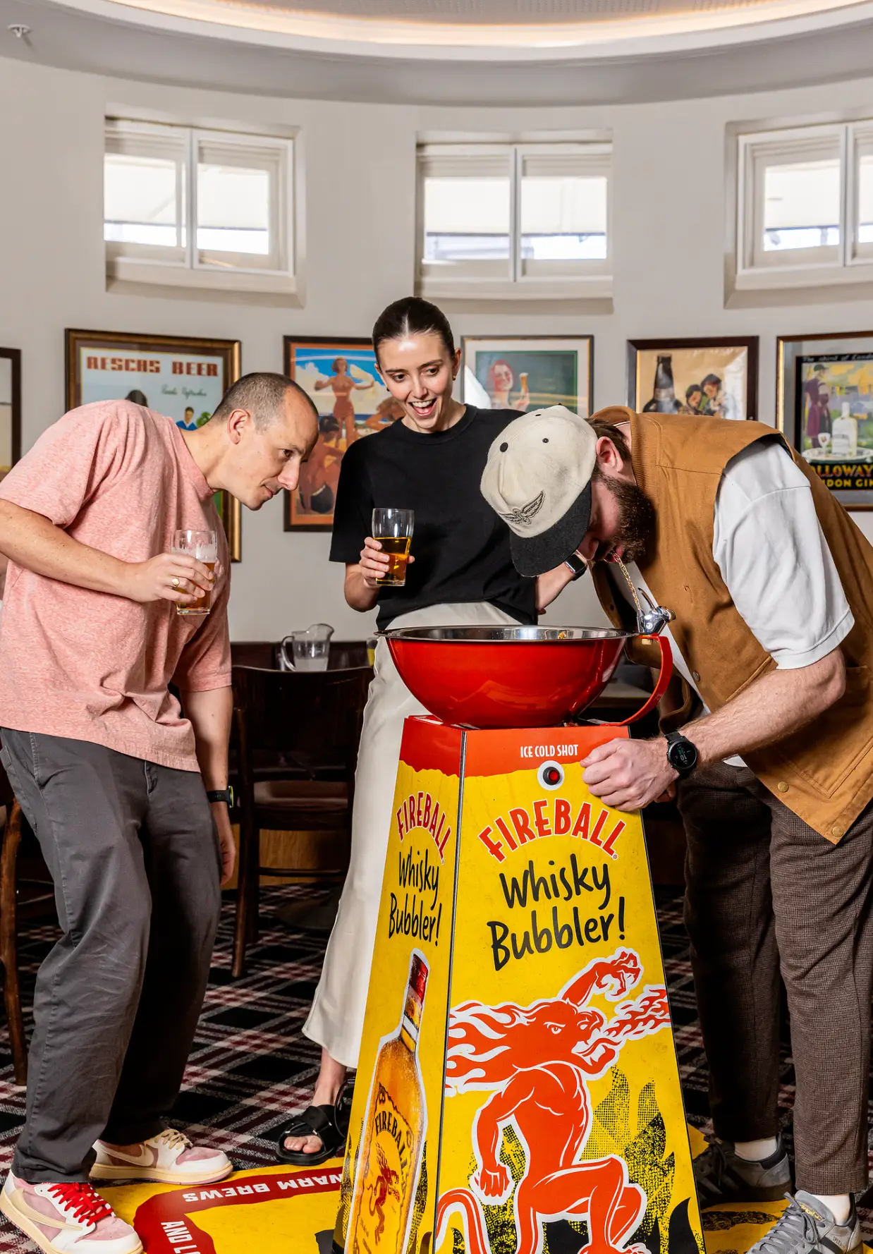 Fireball frother taking the first sip from the Fireball Whisky Bubbler / Supplied: Fireball