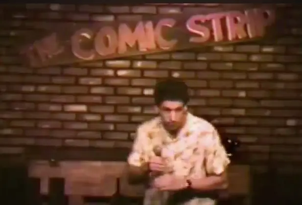 The grainy footage shows Sandler at the beginning of his career.