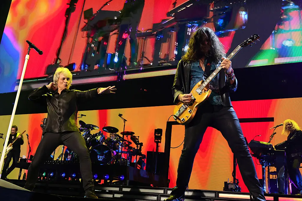 Bon Jovi and Phil X perform onstage at the Forever Tour (Theo Wargo/Getty Images)