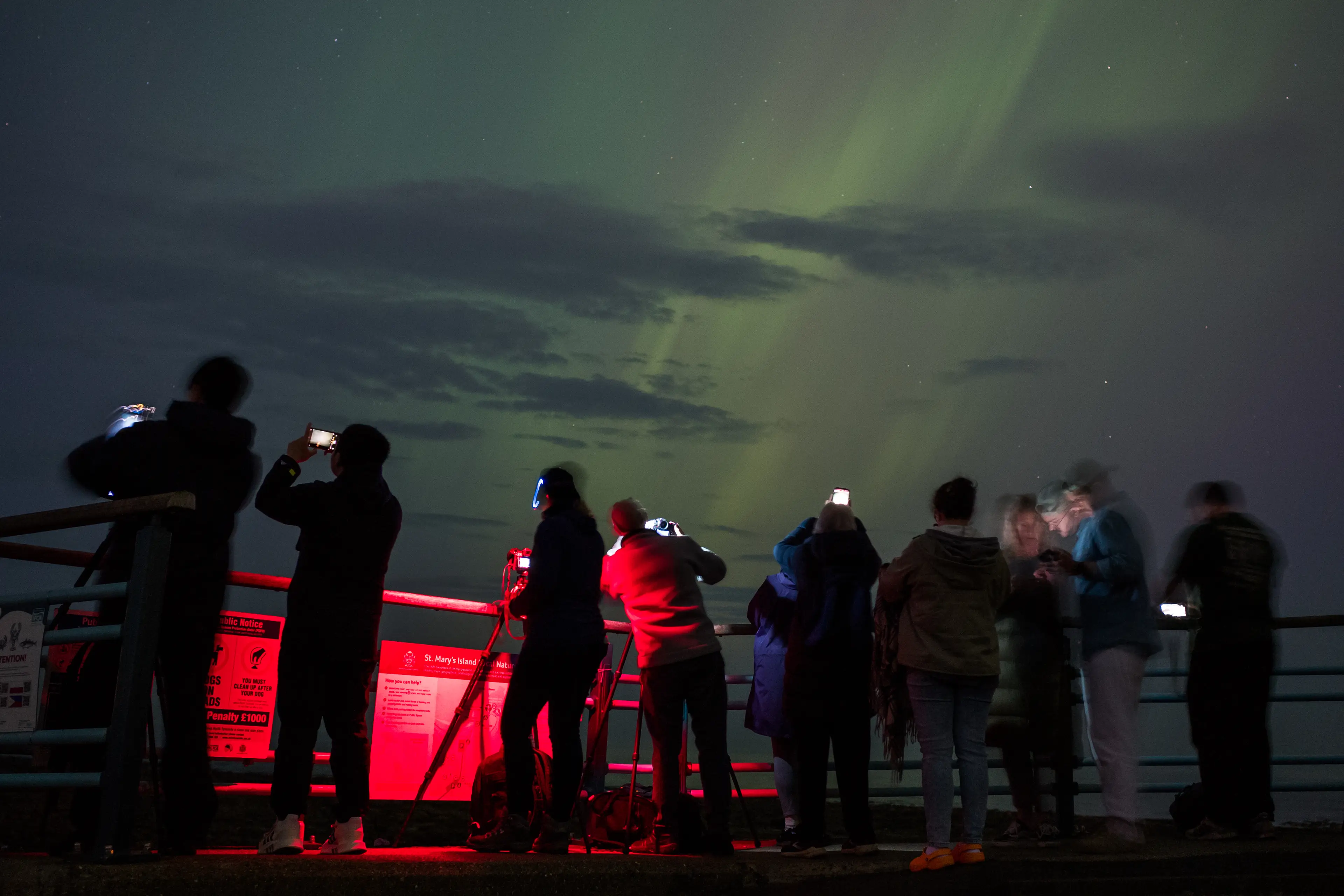 People trying to capture the Northern Lights in Whitley Bay, near Newcastle, last weekend. (Ian Forsyth/Getty Images)