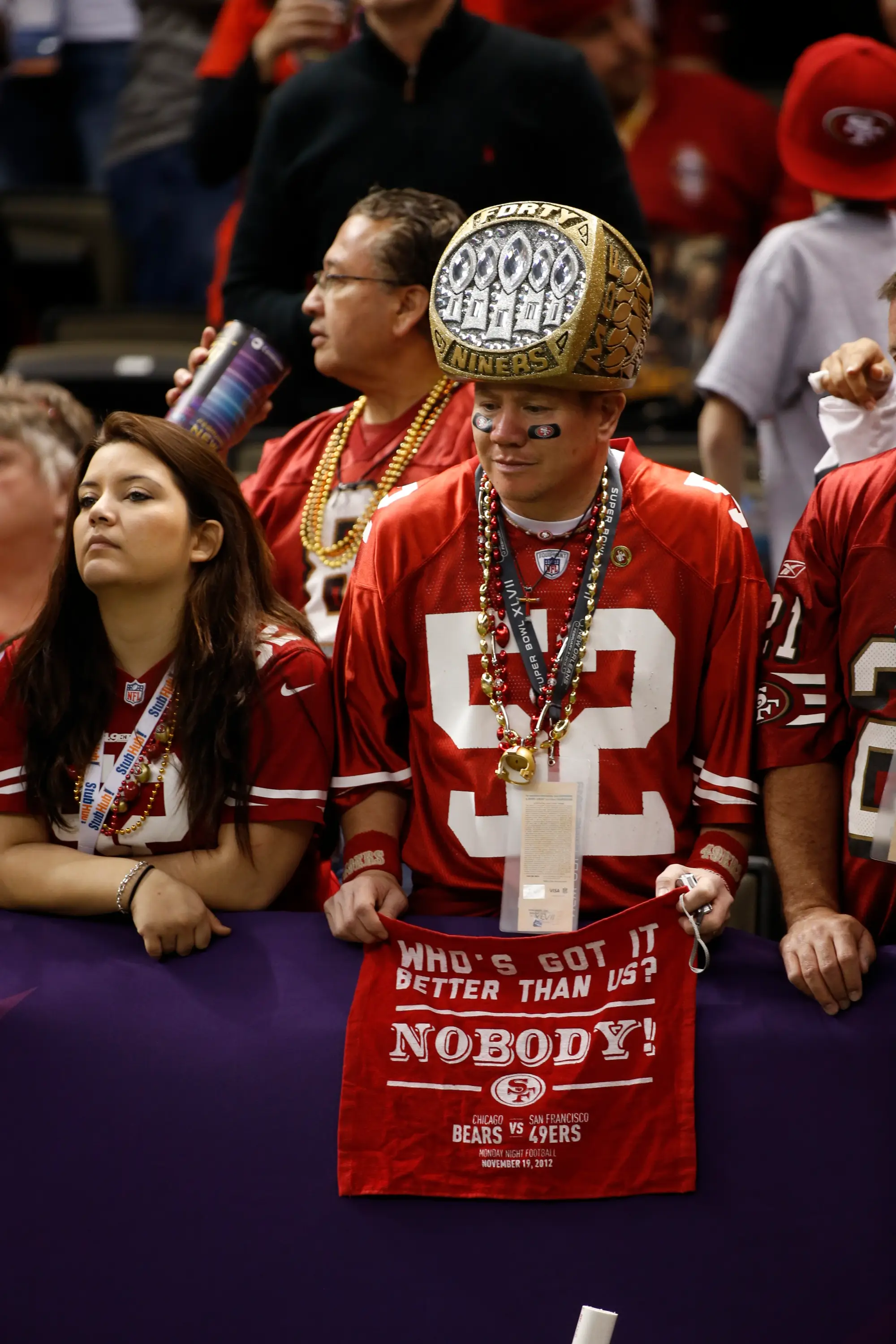 San Francisco 49ers fan wears a Super Bowl ring hat.