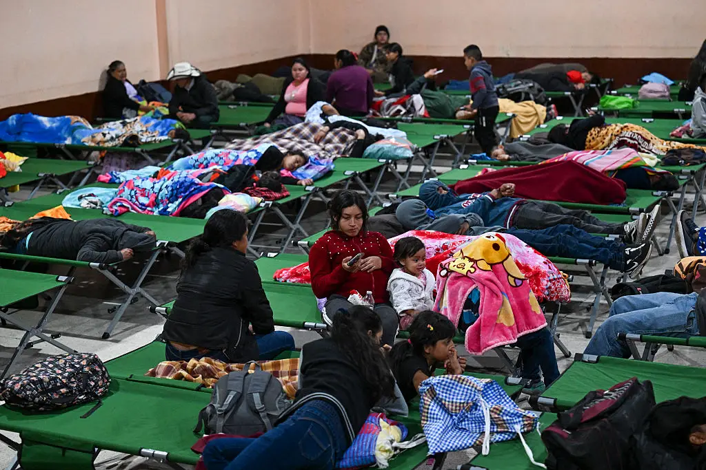 Evacuees at a nearby shelter (Johan ORDONEZ / AFP via Getty Images)