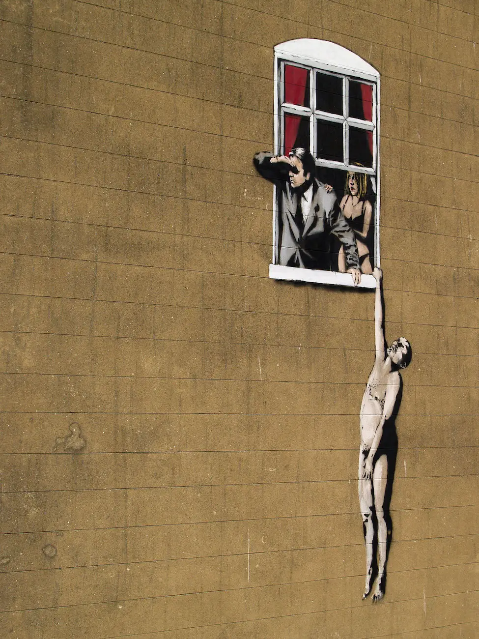 A graffiti design by the mysterious Banksy in Bristol, England.