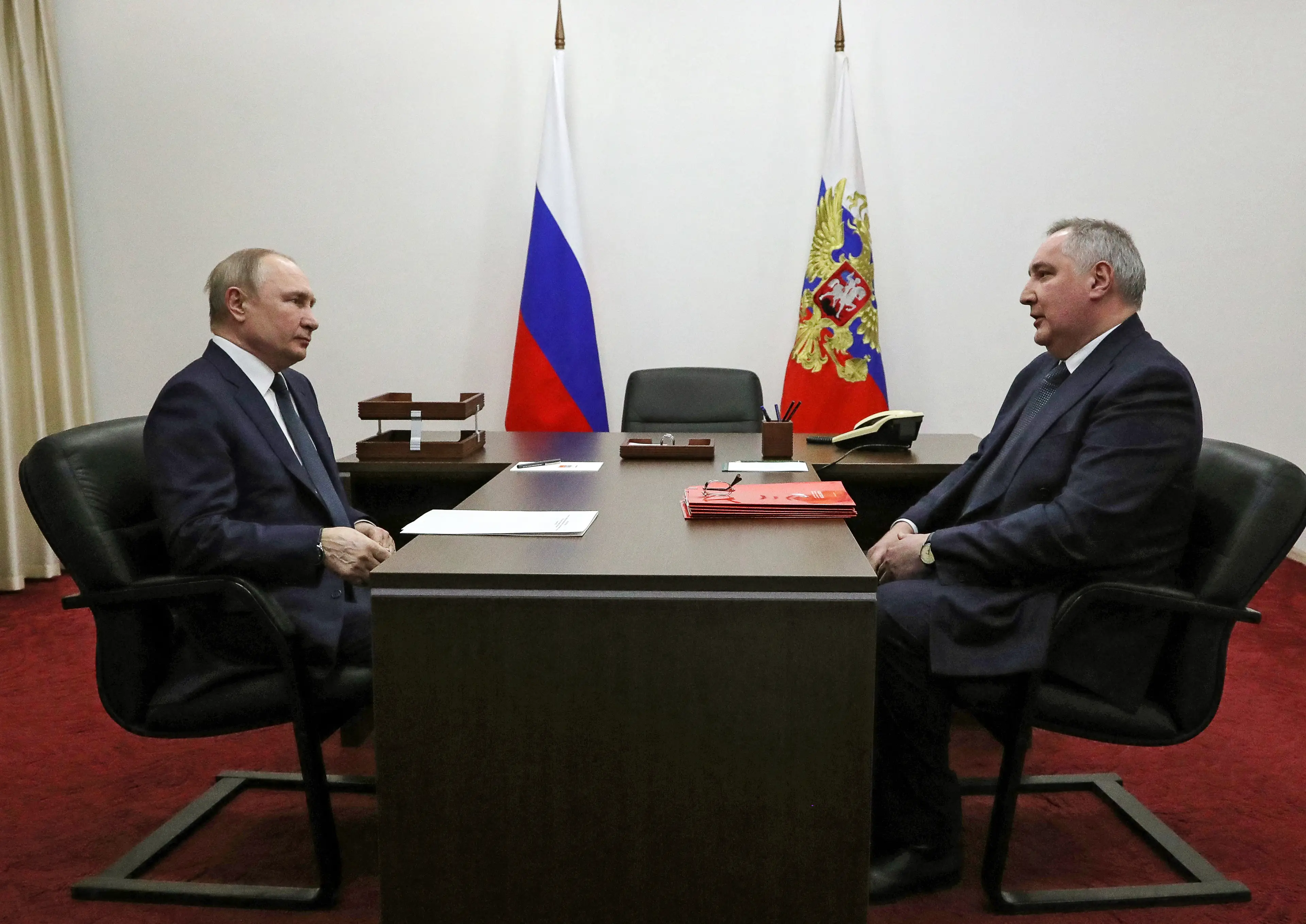 Putin and Dmitry Rogozin (MIKHAIL KLIMENTYEV/Sputnik/AFP via Getty Images)