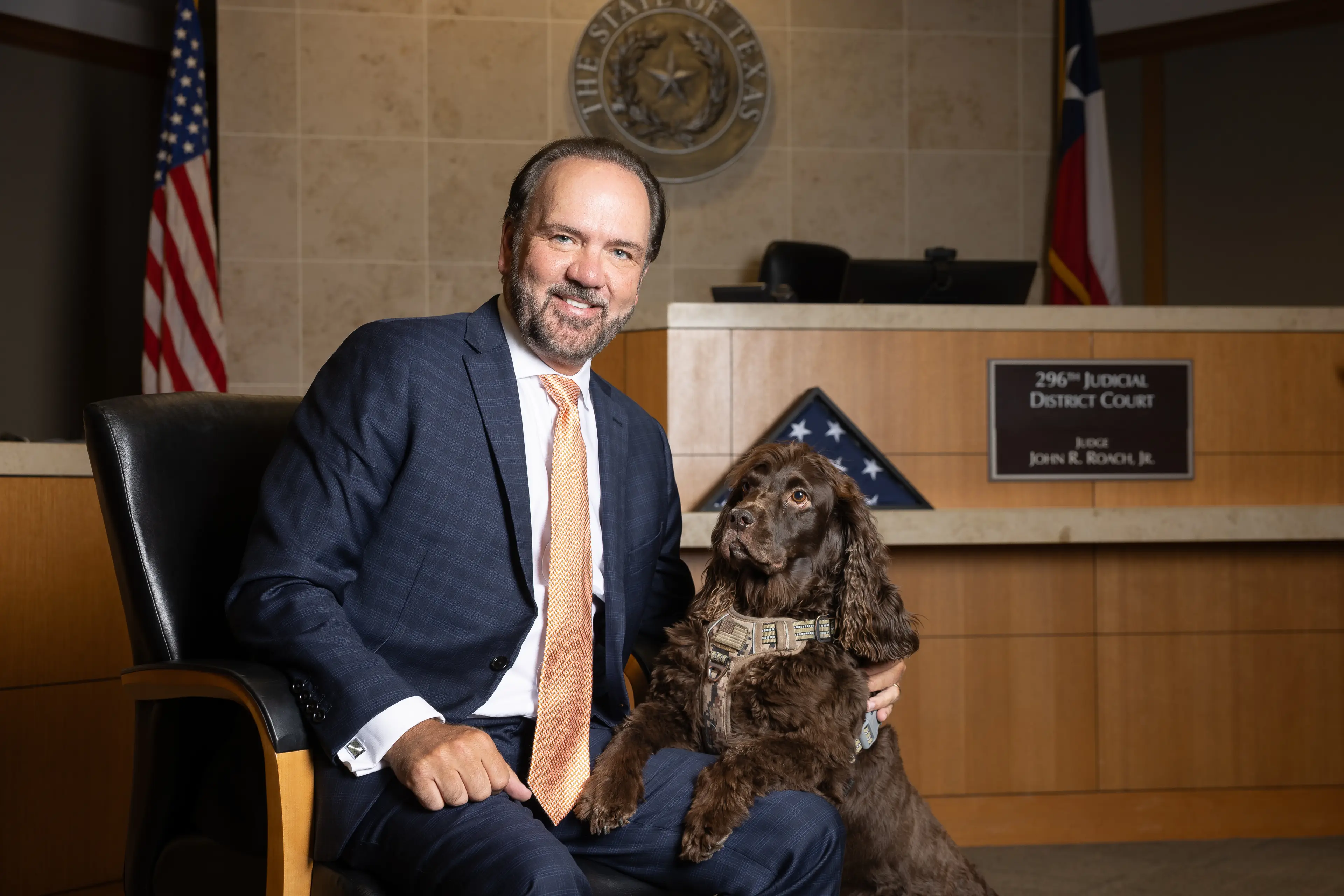 Former District Attorney John Roach with his dog 'Justice' (Juan Figueroa/The Dallas Morning News via Getty Images)