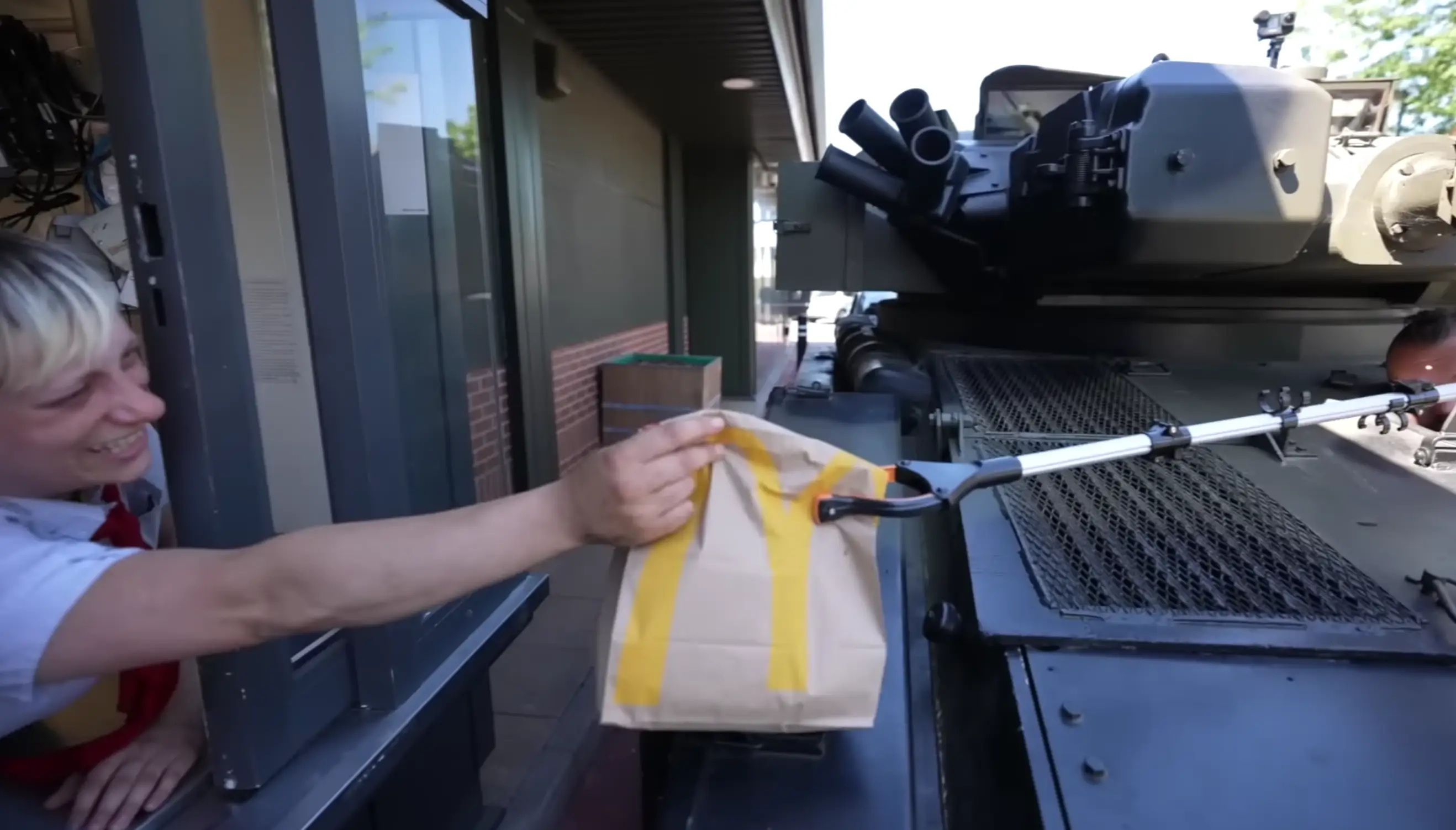 Hall was instructed to drive to the next window and into the drive-thru area armed with a litter picker to pay for and pick up the goods.
