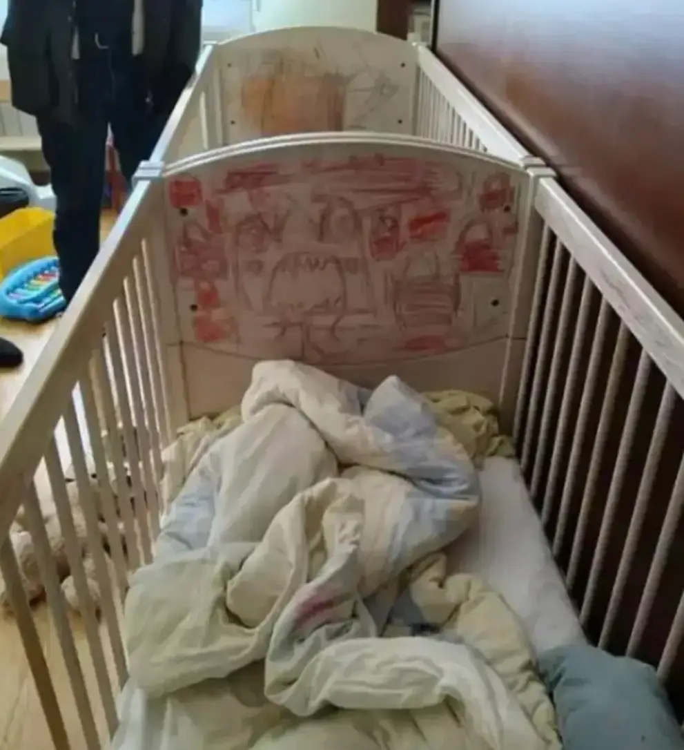 The kids slept in cots which were covered in scribbles (Police Handout)(Police Handout)