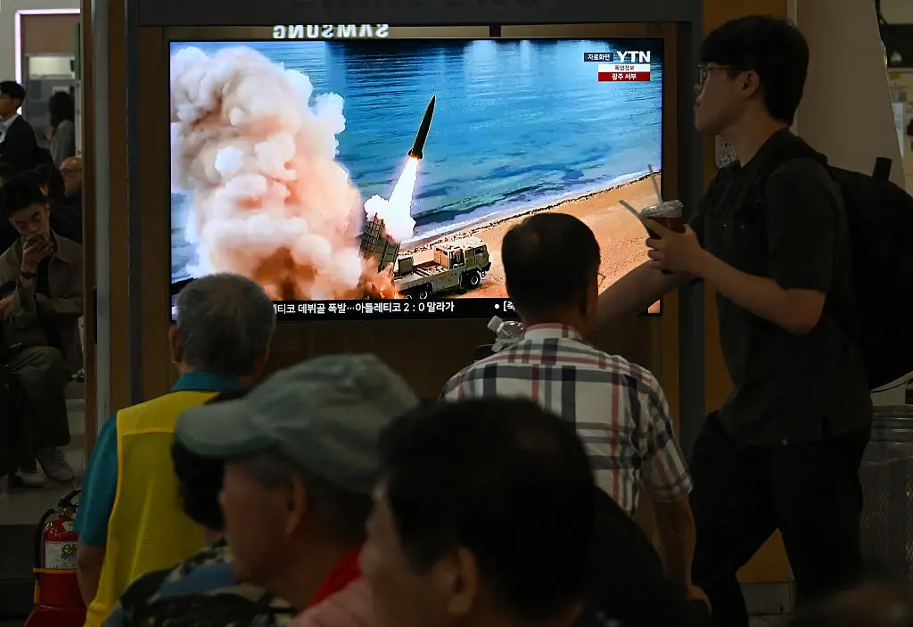 People watch a television screen showing a North Korean missile test (Jung Yeon-je / AFP via Getty Images)